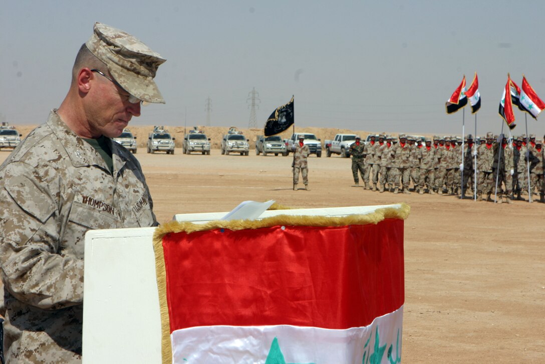CAMP PHOENIX, Iraq- Col. David M. Thompson, the officer in charge of the Military Transition Team, attached to Regimental Combat Team 2, delivers his speech during the validation ceremony for 3rd Brigade, 7th Iraqi Army Division, while three platoons of Iraqis stand at parade rest.  The brigade is newly formed and will eventually fully take over Al Qa?im?s area of operations protecting its people against insurgent activity outside the city.