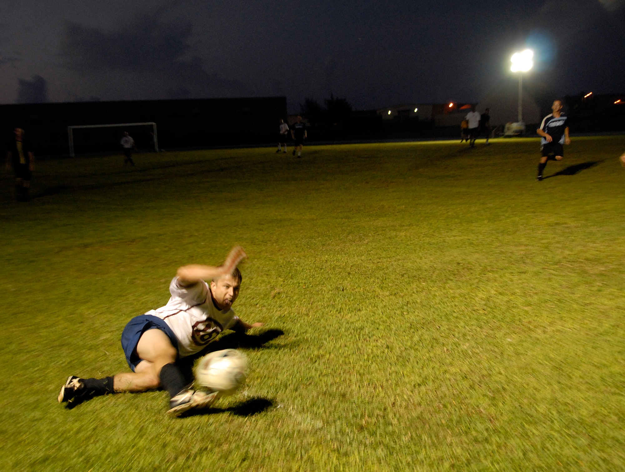 ANDERSEN AIR FORCE BASE, Guam - A Helicopter Sea Combat Squadron TWENTY-FIVE player continues the action by keeping the ball inbound Aug. 28 during intramural soccer bat Andersen's soccer field. (Photo by Airman 1st Class Daniel Owen/36th Wing Public Affairs)