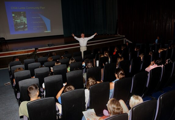 Ken Wooden, renowned speaker and child sexual abuse expert, speaks to families in the Keystone Theater on Kadena Air Base, Japan, Aug. 27, about sexual predators and the lures they use to trap child and young adult victims.  Mr. Wooden travels around the world educating children and their families about being proactive to counter sexual predators.  He has also made a variety of television appearances, including the Oprah Winfrey Show.   (U.S. Air Force photo/Tech. Sgt. Reynaldo Ramon) 