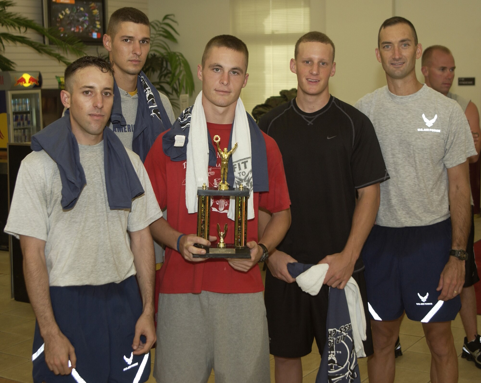 ANDERSEN AIR FORCE BASE, Guam - Staff Sgt. Corey Vento, Senior Airman Kyle Altstaetter, Airman 1st Class Andrew Rogers, Airman 1st Class Steven Burlbaw and Maj. Troy Roberts, formed the 736th Security Forces Squadron team that won Andersen's Fitness Challenge Sept. 1 at the base fitness center.  The 554th RED HORSE squadron won second place and the 36th Operations Support Squadron took third.  Major Roberts placed first in the three mile run and the sit and reach contests; Senior Airman Bryan Nagy, from the 644th Combat Communications Squadron, placed first placed in the push ups and sit ups contests; and 1st Lt. John Casey, from the 554th RED HORSE Squadron, placed first in the body composition category.  (Photo by Tech Sgt. Brian Bahret/36th Wing Public Affairs)