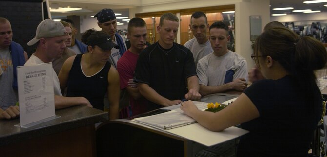 ANDERSEN AIR FORCE BASE, Guam - Staff Sgt. Andrea Manibusan, fitness center staff, gives competitors an overview of Andersen's Fitness Challenge which was held Sept. 1 at the fitness center. Three five-man teams competed in the challenge.  Individuals were measured in five categories: abdominal circumference, three mile run, sit and reach, push ups and sit ups.  The fitness center staff averaged the scores to determine which team was the overall winner.  The 736th SFS won the fitness challenge.   