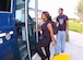 India Hicks, 19, and Justin Yerby, 16, board a base bus shuttle at the main gate Tuesday. India is a cashier at Burger King. Justin is a stocker in Family Furniture at the Base Exchange. The shuttle begins running at 6:30 a.m. The shuttle begins at the Main gate and makes stops at the wing headquarters building, bldg. 1535, the hospital, the Gateway Inn, the Passenger Terminal and the Commissary. The entire run takes an estimated 40 minutes to return to the Main Gate. For more information, call the 316th Logistics Readiness Squadron at 301-981-1182.