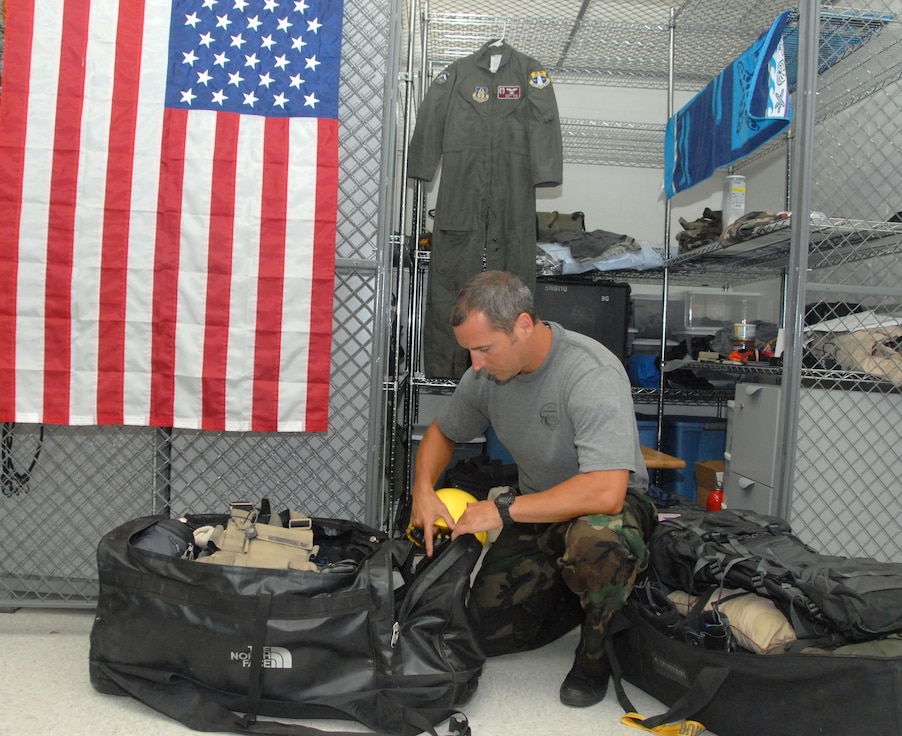 Air Force Reservist Staff Sgt. Patrick Dunne, 308th Rescue Squadron pararescueman, Patrick Air Force Base, Fla.,finishes up packing in preparation for his trip to Oregon where he will assist in the recovery of two climbers on Mt Hood who were never found in a search and rescue effort Dec. 2006. (Air Force photo/Master Sgt. Chance C. Babin)