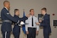 Maj. Gen. Gar S. Graham, 79th Medical Wing commander, stands-by as his sons 2nd Lt. Ross Graham, left, and 2nd Lt. Hudson Graham, right, replace his 1-star epaulets with new ones bearing 2-stars during a promotion ceremony Aug. 24 at the Bolling Club. General Graham was confirmed by the Senate, Aug. 1 and is the first Air Force Dental Corps Chief to wear the rank of Major General.