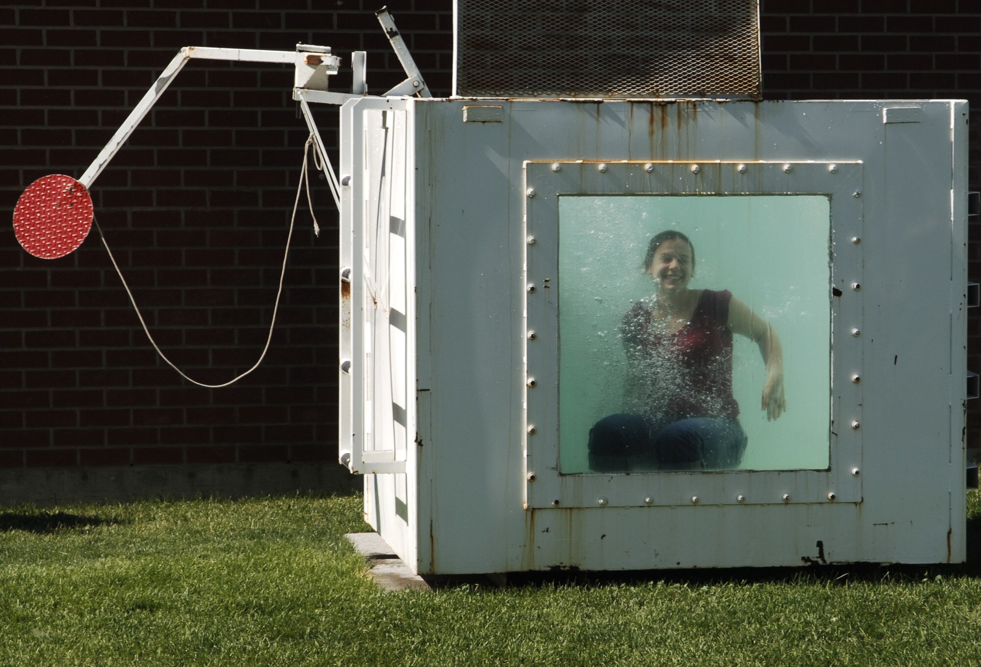 FAIRCHILD AIR FORCE BASE, Wash. – Senior Airman Stephanie Welch, 92nd Logistics Readiness Squadron, takes a turn in the dunk tank during Airmen Appreciation Day activities at Miller Park here Aug. 30. Afternoon festivities also included volleyball, basketball, a water balloon contest and a picnic. (U.S. Air Force photo/Senior Airman Chad Watkins)
