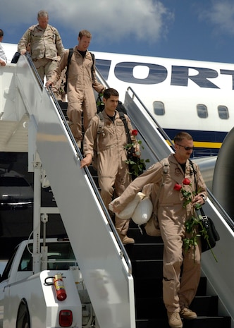 Airmen from the 16th Airlift Squadron make their way off the plane to be with family members and loved ones after returning home to Charleston AFB from a four-month deployment Monday afternoon. (U.S. Air Force Photo/Airman 1st Class Cynthia Spalding)