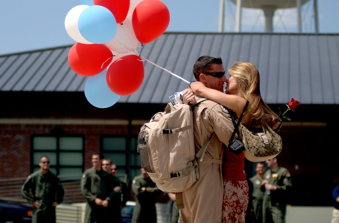 Maj. Scott  Berndt, 16th Airlift Squadron C-17 pilot, and his fiance, Ashley Good, are reunited after his return from a deployment to Southwest Asia. More than 117 Airmen from the 16 AS returned to Charleston AFB Monday after being deployed for mare than four months. (U.S. Air Force Photo/Airman 1st Class Nicholas Pilch)