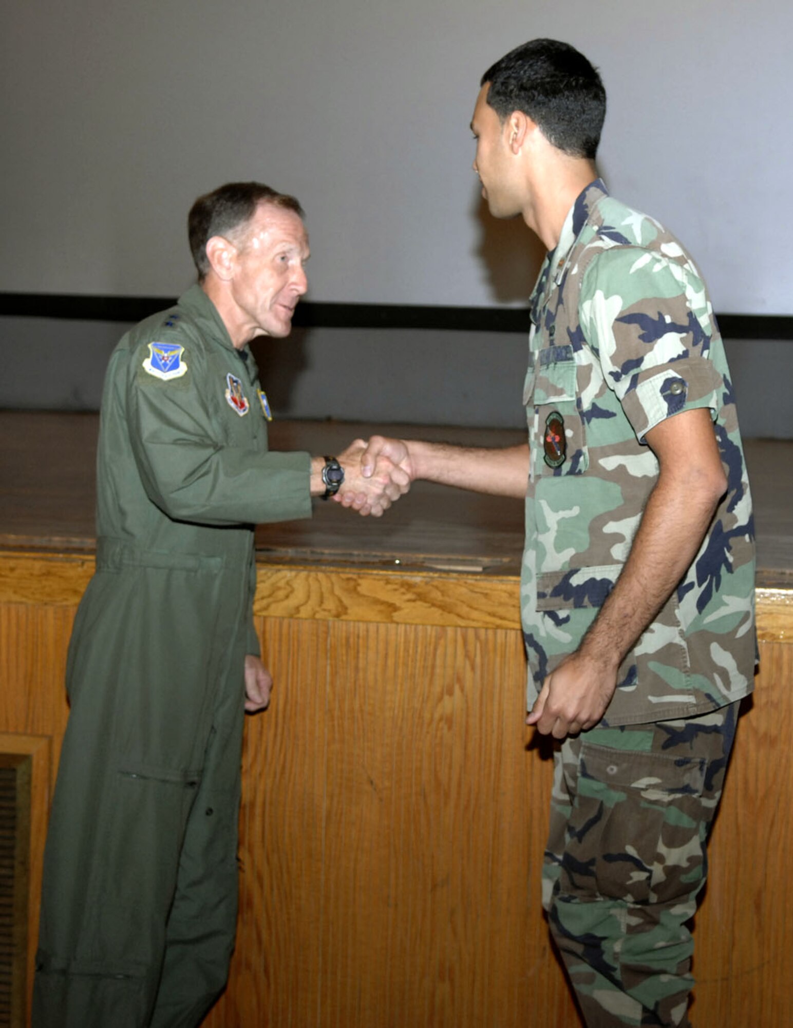 Lt. Gen. Norman Seip, 12th Air Force and Air Forces Southern commander, gave out coins to hand-picked exceptional Airmen at his commander's call during his visit to Holloman Aug. 29. (U.S. Air Force photo/Airman 1st Class Rachel Kocin)