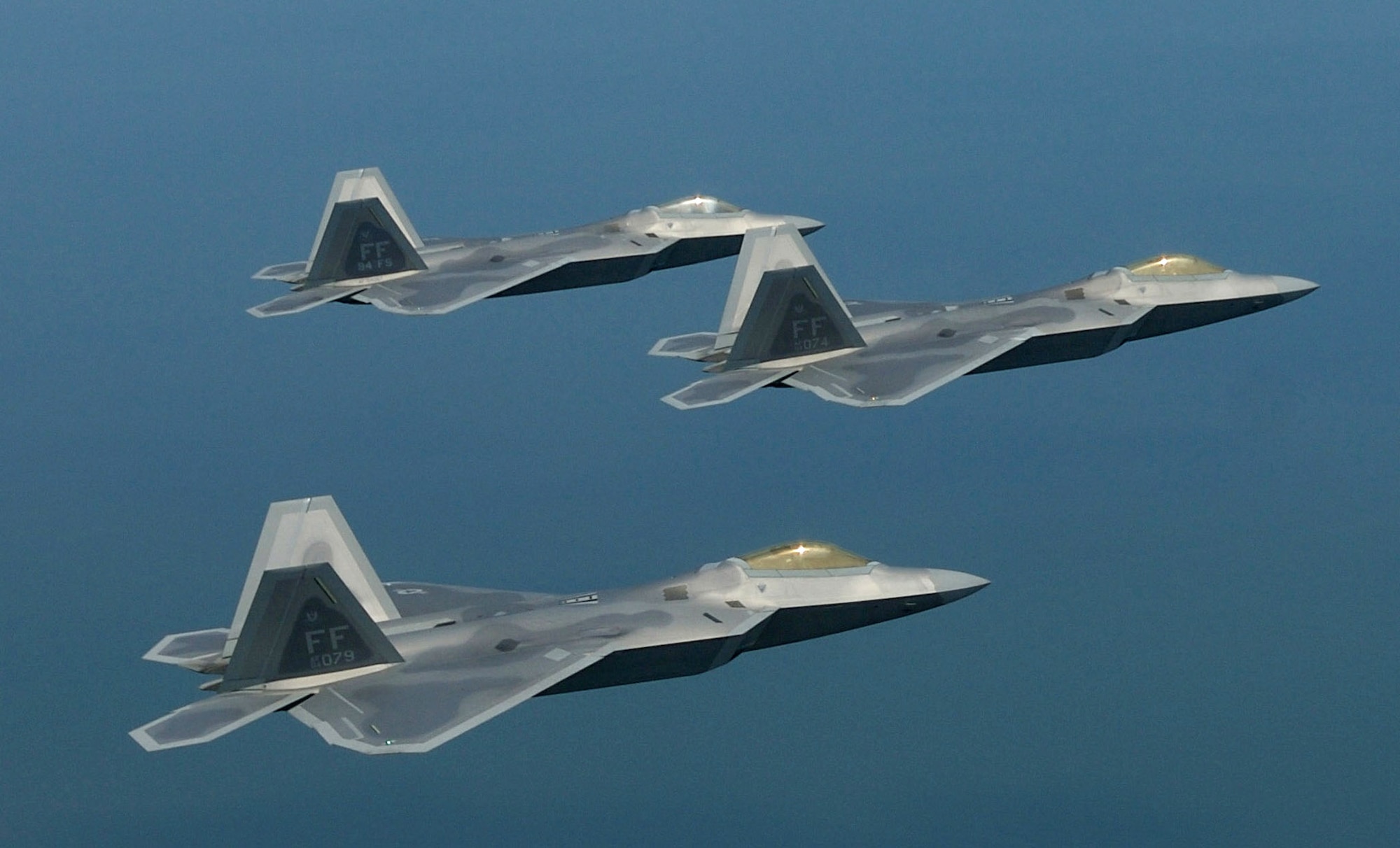 F-22 Raptors fly in formation. Lockheed Martin delivered the 100th F-22 to the Air Force Aug. 29 in Marietta, Ga., and the latest aircraft will be assigned to the 90th Fighter Squadron at Elmendorf Air Force Base, Alaska. (U.S. Air Force photo/Staff Sgt. Samuel Rogers)