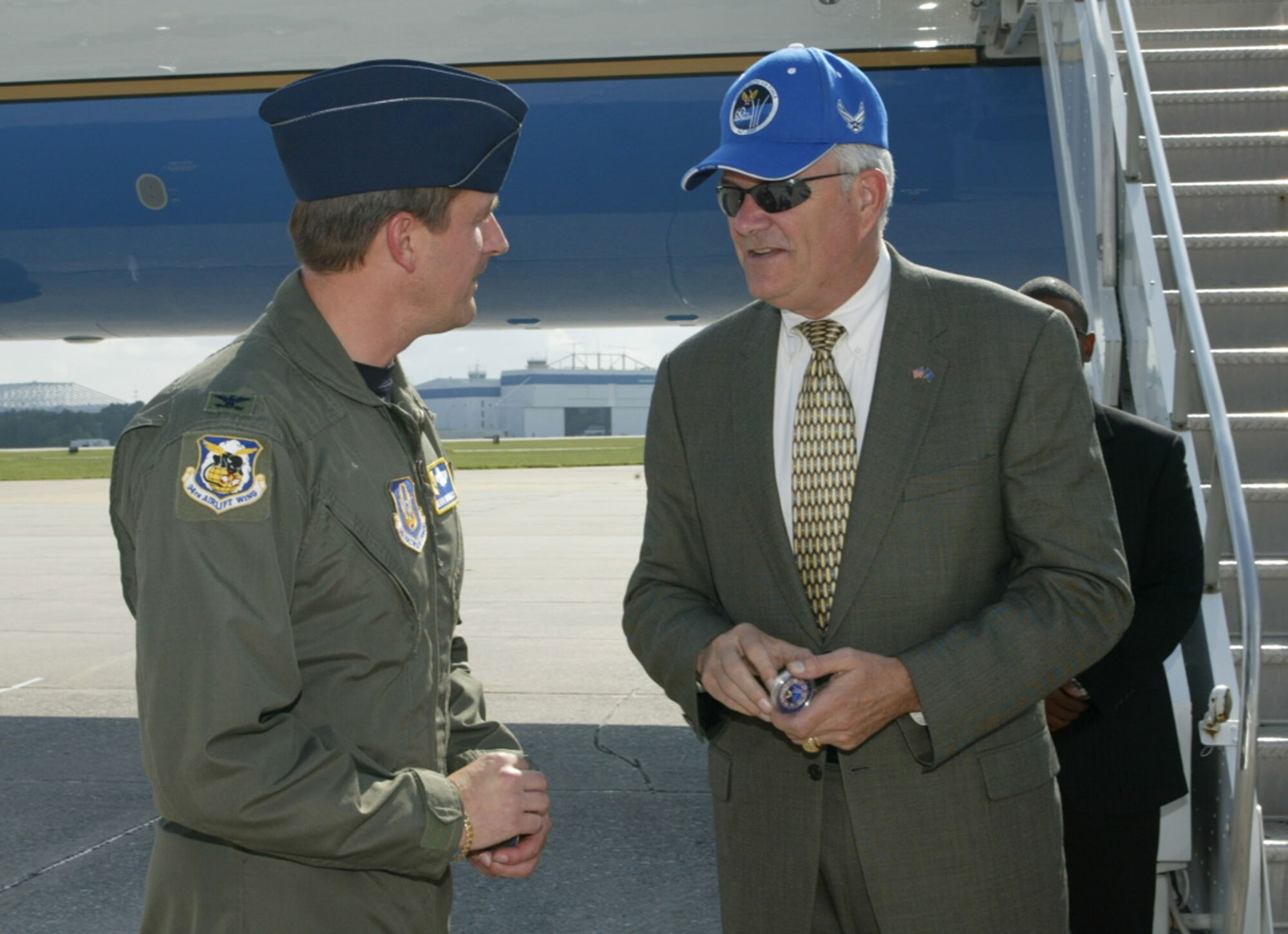 Col. Heath Nuckolls, 94th Airlift Wing commander, presented Secretary of the Air Force, Michael W. Wynne with an Air Force Week Atlanta coin on Mr. Wynne's arrival to Dobbins Air Reserve Base Aug 28. Mr. Wynne came to Marietta for the rollout of the 100th F-22 at the Lockheed Martin Aeronautics plant here.  