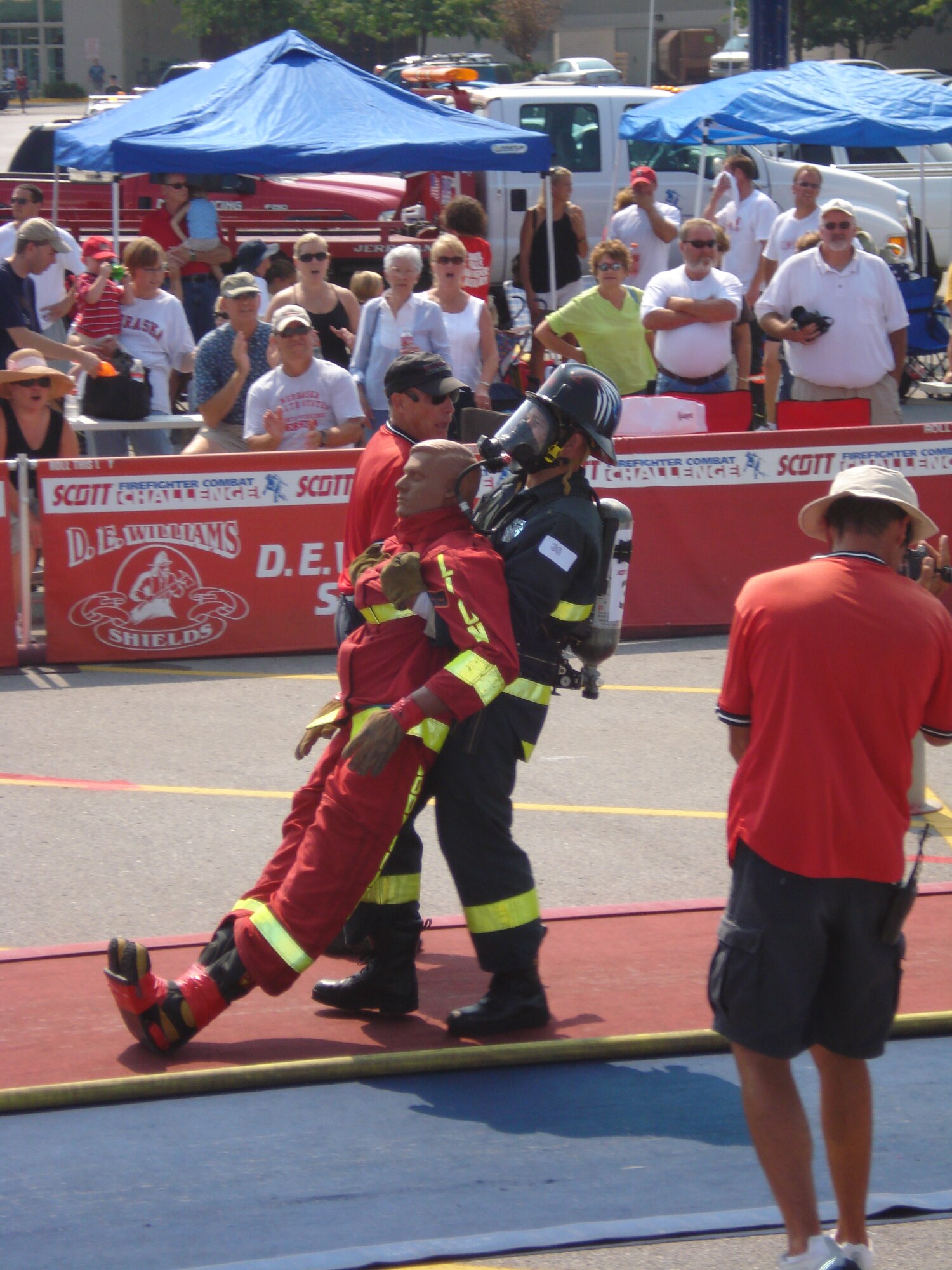 Staff Sgt. Cory McGee, 509th Civil Engineer Squadron, drags a 175-pound rescue mannequin toward the finish line at the Scott Firefighter Combat Challenge at Omaha, Neb., Aug. 18-19. Sergeant McGee, who was part of a three-man firefighting team from Whiteman, won first place in the five-part competition, and answered his winning performance with another victory the following weekend at Sioux Falls, S.D., Aug. 23-26. (Photo printed with permission of Staff Sgt. Joshua Miller)