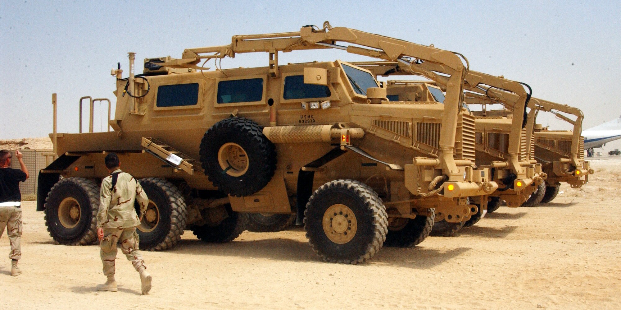 Tech. Sgt. Shawn Tague shows Lt. Col. Gerard Couvillion the Mine Resistance Ambush Protected vehicles before loading them into a C-17 Globemaster III Aug. 25 at Al Asad Air Base, Iraq. The new MRAP Category III Buffalo models, which cost between $600,000 and $1 million each, will phase out the High Mobility Multipurpose Wheeled Vehicles, also known as Humvees. MRAPs are designed with V-shaped bottoms raised more than 3 feet off the ground to reduce servicemembers casualties by protecting them from improvised explosive devices, and to increase their mobility and enhance mission success throughout the areas of responsibility. Sergeant Tague is assigned to the 438th Aerial Port Flight and is deployed from Pope Air Force Base, N.C. Colonel Couvillion is the 438th Expeditionary Support Squadron commander. (U.S. Air Force photo/Senior Airman Olufemi A. Owolabi) 
