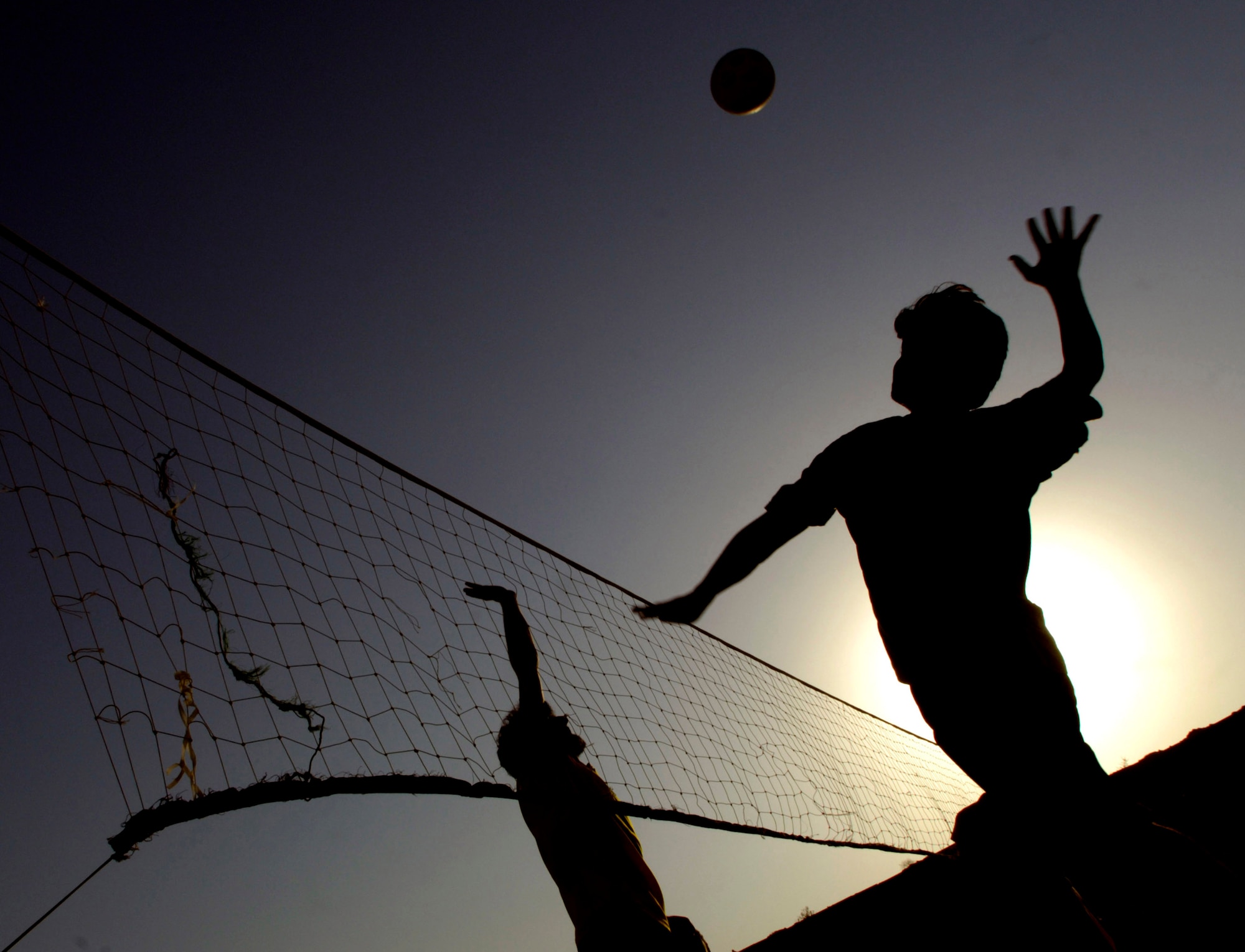 Airmen and Soldiers from the Provincial Reconstruction Team host a volleyball game Aug. 26 for Afghan high school students invited from the province's five districts Aug. 26 at Forward Operating Base Mehtar Lam, located in Afghanistan's Laghman Province. The weekly volleyball games are designed to give the students a chance to meet and interact with military members in a friendly atmosphere. (U.S. Air Force photo/Master Sgt. Jim Varhegyi) 
