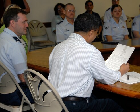 ADELUP, Guam - Guam's Lt. Gov. Michael Cruz, M.D., reads a prolamation to Andersen Airmen naming Sept. 4 to 9, 207, as Air Force Week.  The Govenor signed  Proclamation No. 2007-081 at the Ricardo J. Bordallo Governor's Complex in Adelup, Guam, Sept. 4.  The signing marked the first day of Air Force Week.  (Photo by Airman 1st Class Daniel Owen/ 36th Wing Public Affairs)


