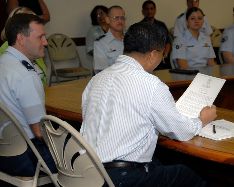 ADELUP, Guam - Guam's Lt. Gov. Michael Cruz, M.D., reads a prolamation to Andersen Airmen naming Sept. 4 to 9, 207, as Air Force Week.  The Govenor signed  Proclamation No. 2007-081 at the Ricardo J. Bordallo Governor's Complex in Adelup, Guam, Sept. 4.  The signing marked the first day of Air Force Week.  (Photo by Airman 1st Class Daniel Owen/ 36th Wing Public Affairs)


