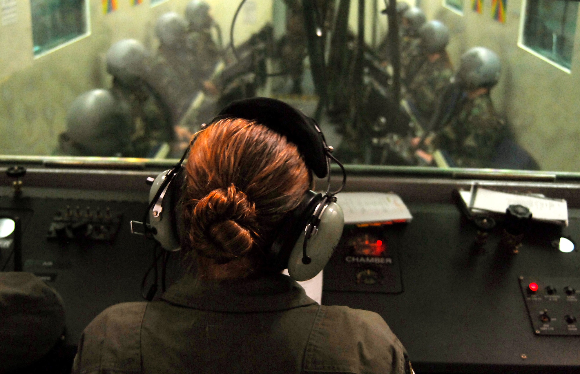 Senior Airman Tara Schmidt quizzes students as they prepare their bodies for the altitude chamber by breathing pure oxygen for 30 minutes Aug. 28, 2007, Kadena Air Base, Japan.  Reviewing subjects like trapped and evolved gases, spatial disorientation, situational awareness, night vision, and hypoxia and hyperventilation, help refresh the students minds with the important information that they will need to remember when they experience the effects of the chamber.  The mission of the altitude chamber is to teach military personnel who fly in aircraft, to identify, recognize and treat symptoms of hypoxia.  Airman Schmidt is an instructor for the Physiological Training Flight, 18th Aerospace Medicine Squadron.  U.S. Air Force photo/Airman 1st Class Kelly Timney