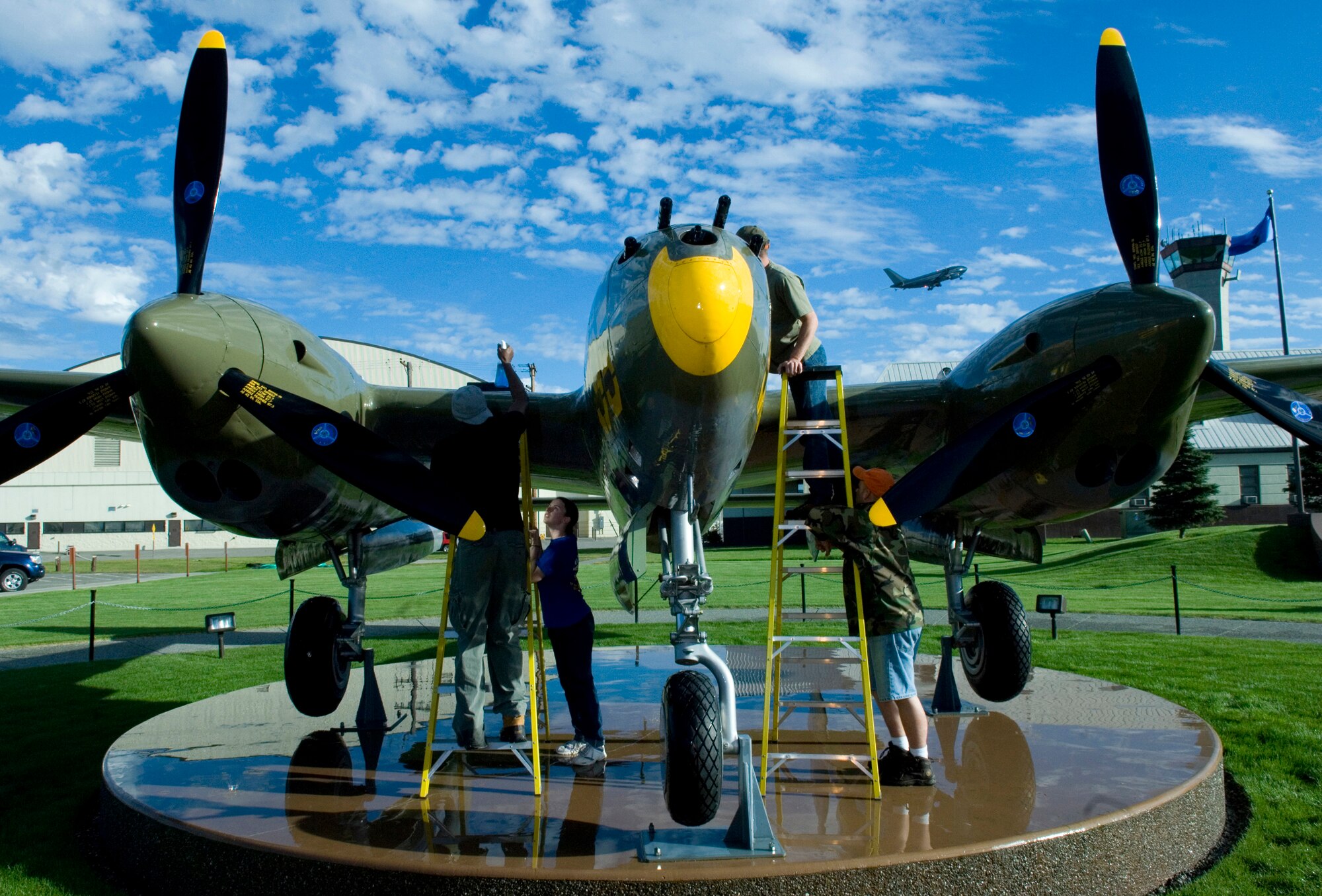 ELMENDORF AIR FORCE BASE, Alaska - The nooks and crannies of the P-86 static display in front of the 3rd Wing headquarters building are cleaned after crews washed the aircraft Aug. 30. More than 70 volunteers from 15 squadrons participated in the Fall Wash. The static displays must be washed twice a year according to an Air Force instruction. (U.S. Air Force photo by Senior Airman Garrett Hothan)