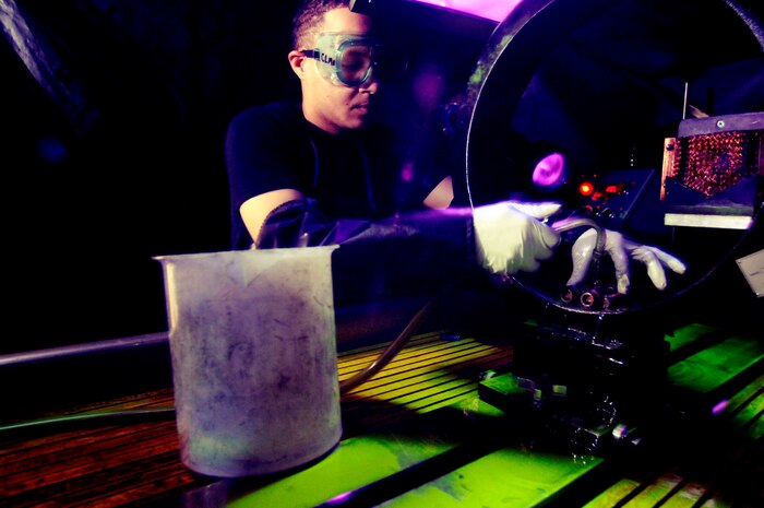 Senior Airman Alton Lee, 437th Maintenance Squadron nondestructive inspection specialist, inspects main landing gear bolts from a C-17 using a magnetic particle inspection process Wednesday at the NDI lab on Charleston AFB. (U.S. Air Force photo/Airman 1st Class Nicholas Pilch) 