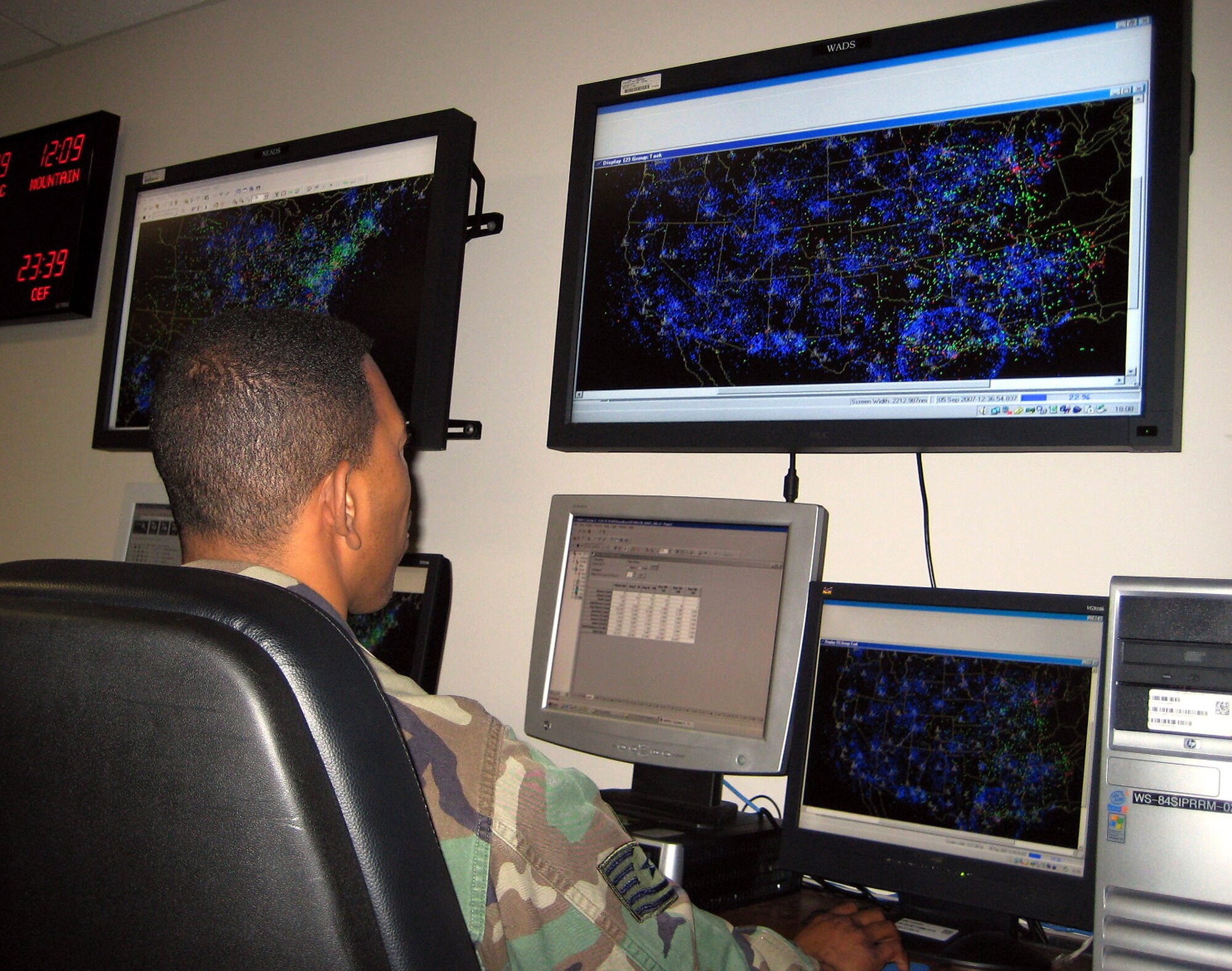 Tech. Sgt. Anthony Church analyzes raw radar data recorded over the Sierra Nevada to assist authorities in the rescue efforts for adventurer Steve Fossett Sept. 5. Sergeant Church is a 84th Radar Evaluation Squadron radar data analyst. (U.S. Air Force photo/Senior Airman Clay Murray)