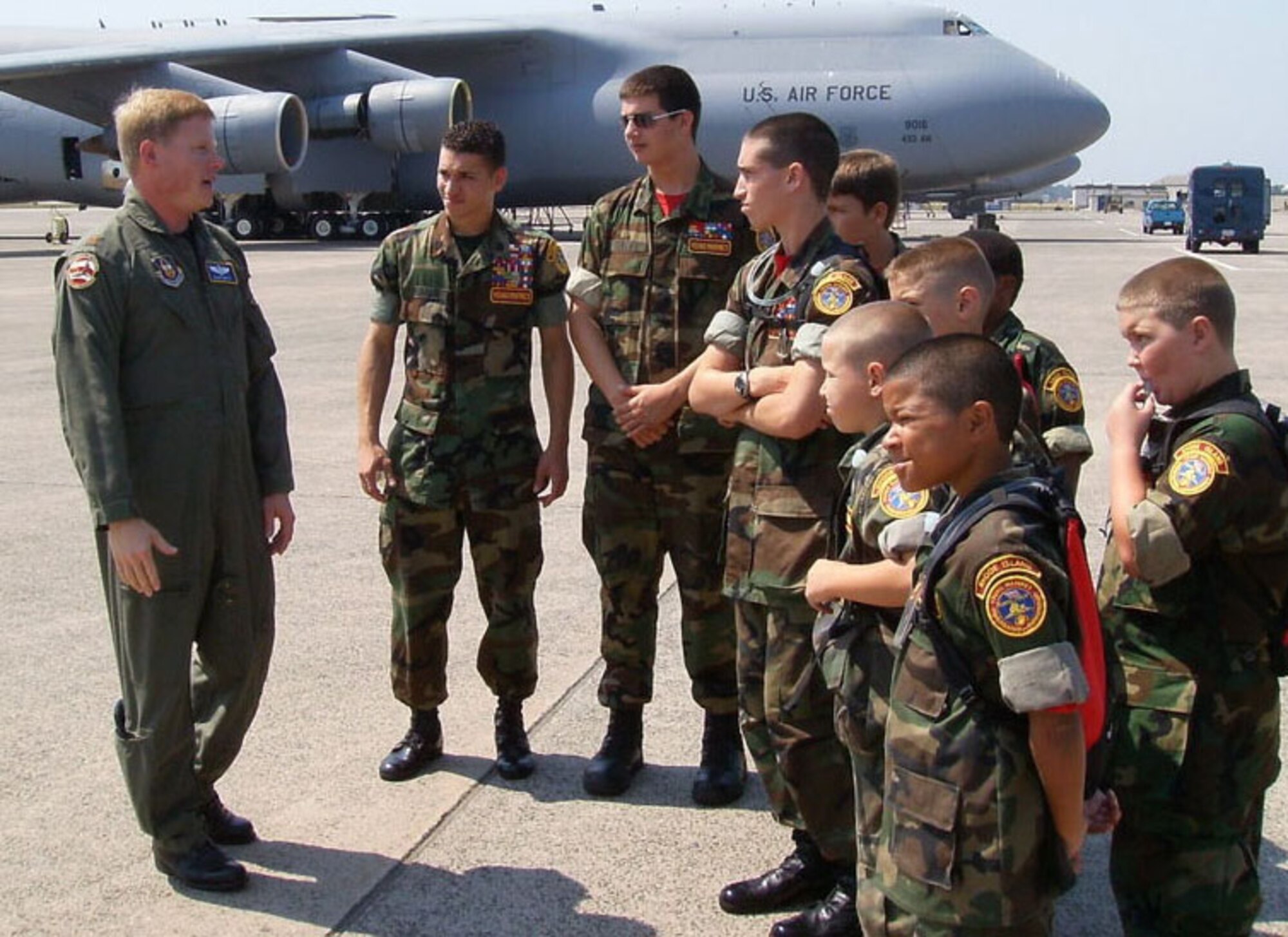 Maj. David Smith, a C-5 pilot with Westover's 439th Operations Support Squadron, explains the mission of the airlifter to members of the Rhode Island Young Marines during a recent base tour. (US Air Force photo by Staff Sgt. Evelyn Albarran)