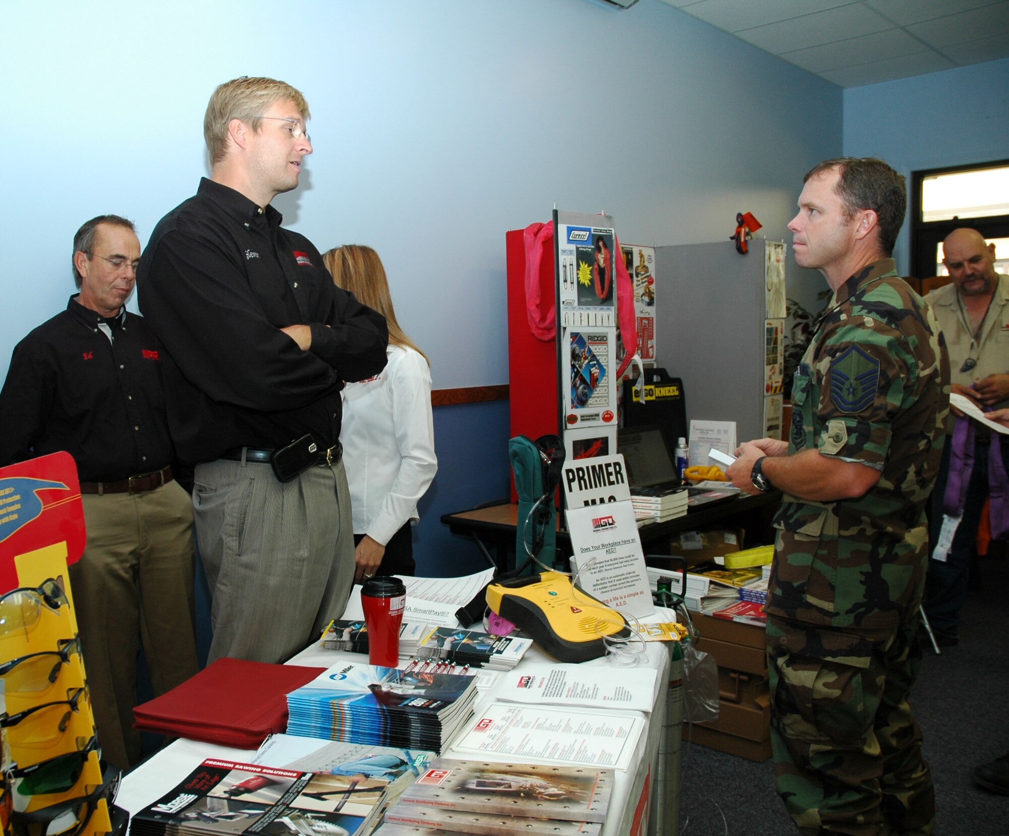 Glenn Bliss from General Distributing talks to Master Sgt. Sean O'Connell, 120th Fighter Wing, about the company at the Government Purchase Card event at the chapel Sept. 5. The event was held for local vendors to get familiar with the base and expose base members to the services they provide. 