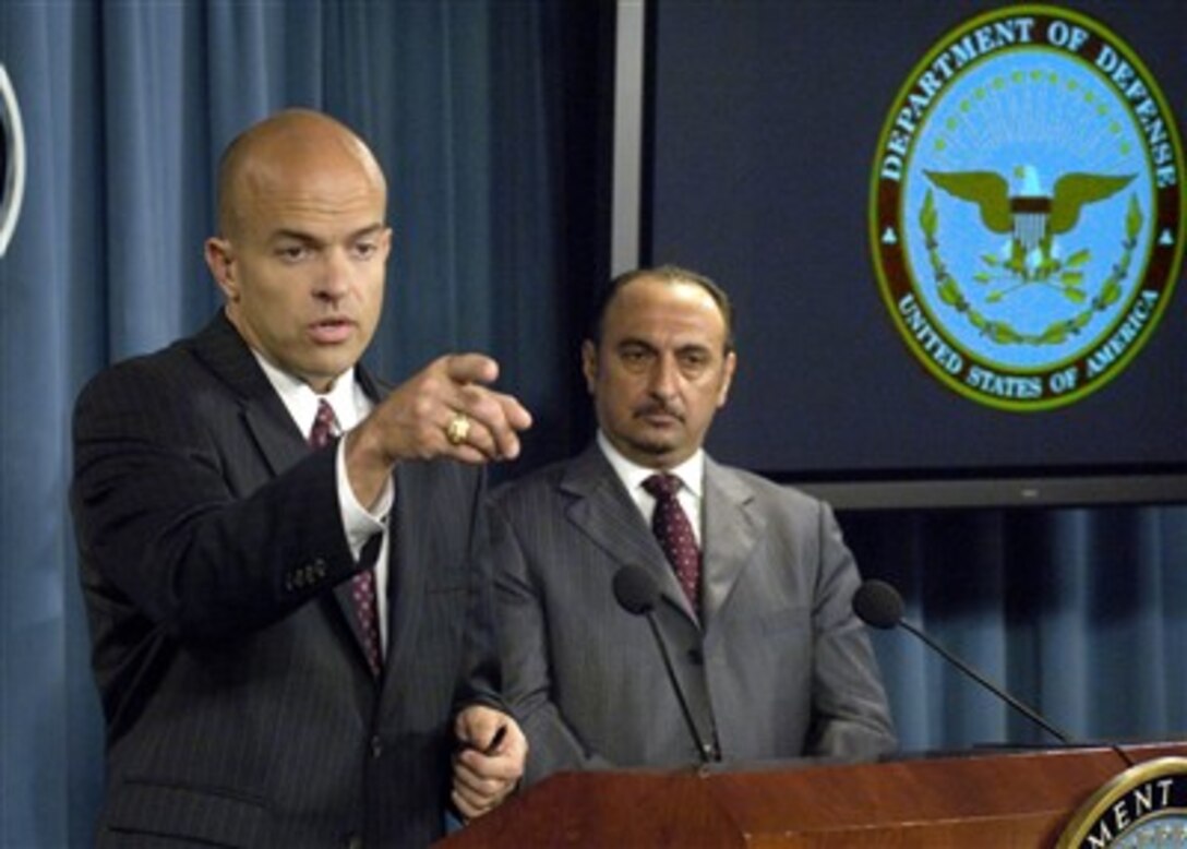 Deputy Under Secretary of Defense for Business Transformation and Director of the Task Force to Improve Business and Stability Operations in Iraq Paul Brinkley (left) calls for a reporter's question during a joint press conference with Iraq's Minister of Industry and Minerals Fawzi Hariri in the Pentagon on Sept. 4, 2007.  The two men discussed the progress being made revitalizing Iraq's economy, by opening factories, modernizing equipment and manufacturing, and the role being played by government and private sector influences.  