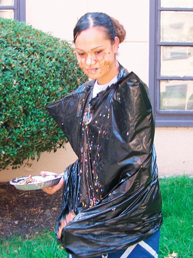 Senior Airman Elizabeth Uzelac seeks revenge after taking and wearing a pie. Airman Uzelac is assigned to the 316th Comptroller Squadron as a customer support technician.