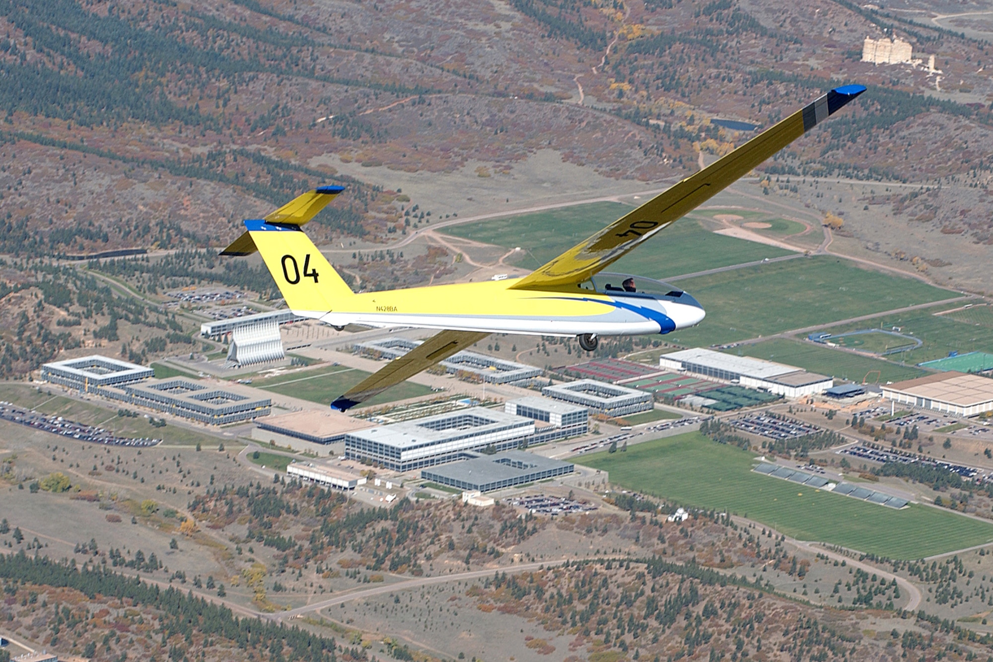 Maj. Eric Ujfalusy, 70th Flying Training Squadron A Flight operations officer, flies a TG-10B glider over the U.S. Air Force Academy cadet area. (U.S. Air Force photo)