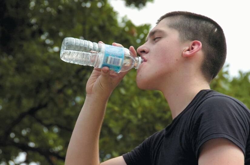 Airman Alexander Malcolm hydrates himself at the end of the day-long training session training.