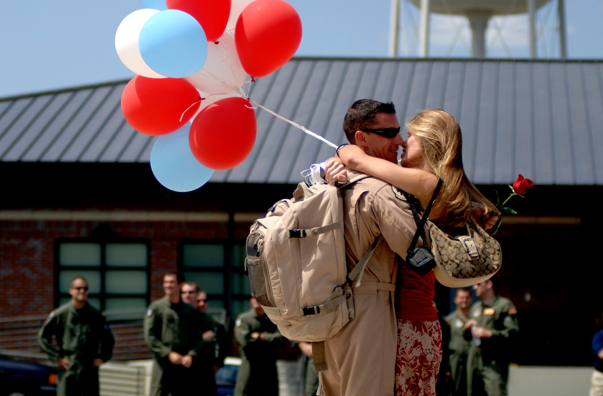Maj. Scott  Berndt and his fiance, Ashley Good, are reunited after his return from a deployment to Southwest Asia Sept. 3 at Charleston Air Force Base, S.C. More than 117 Airmen from the 16th Airlift Squadron returned to Charleston AFB after being deployed for more than four months. Captain Berndt is a 16th AS C-17 pilot. (U.S. Air Force photo/Airman 1st Class Nicholas Pilch)