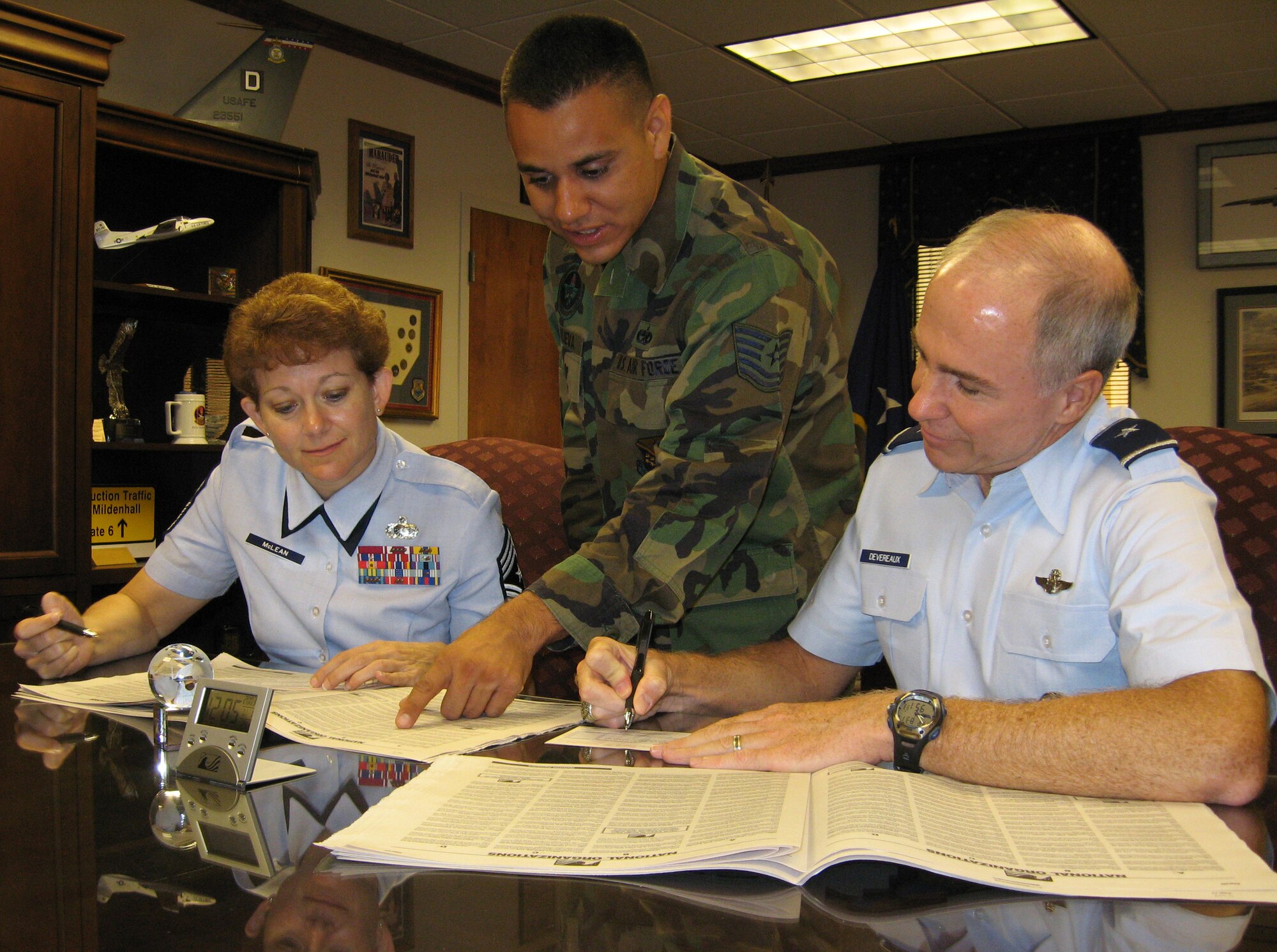 Tech. Sgt. Vincent Villanueva, 361st Training Squadron, points out possible charities to 82nd Training Wing Command Chief Chief Master Sgt. Jeannie McLean as she and 82nd TRW Commander Brig. Gen. Richard Devereaux fill out their Combined Federal Campaign fund forms.  Sheppard's CFC fundraising cycle began Sept. 4 and will run through Oct. 16. (U.S. Air Force photo/George Woodward)
