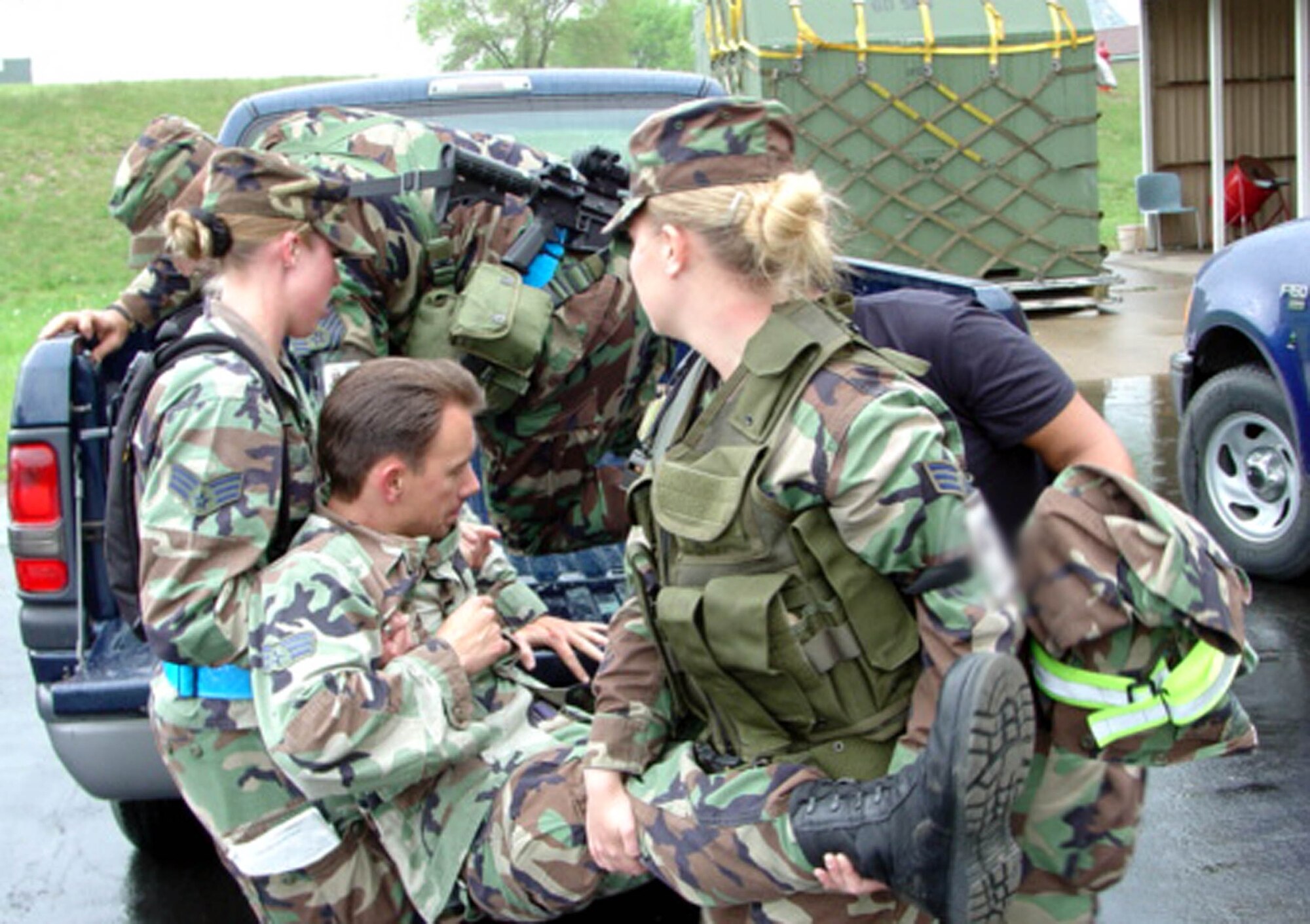 Airmen carefully remove an injured Airman using Self Aid and Buddy Care techniques during an exercise. Military members must have formal SABC training once every 22 months or within 90 days of a deployment. (U.S. Air Force photo)