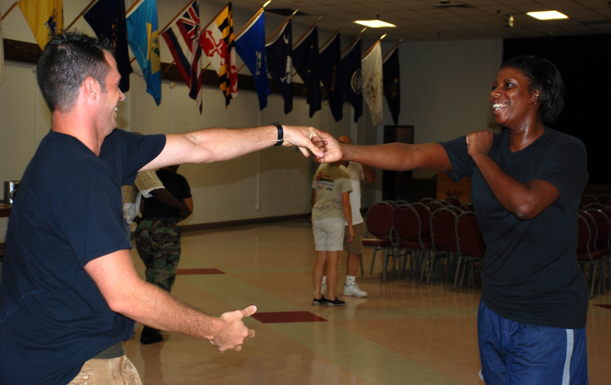 Staff Sgt. Dylan Lamont and Tech Sgt Latreece Shephard and of the 383rd Training Squadron practice the "rock step" at the swing dance classes being held at the Community Activity Center.  The classes are to help the dancers prepare for their number at the Air Force 60th Anniversary Ball. (U.S. Air Force photo/Airman 1st Class Jacob Corbin)