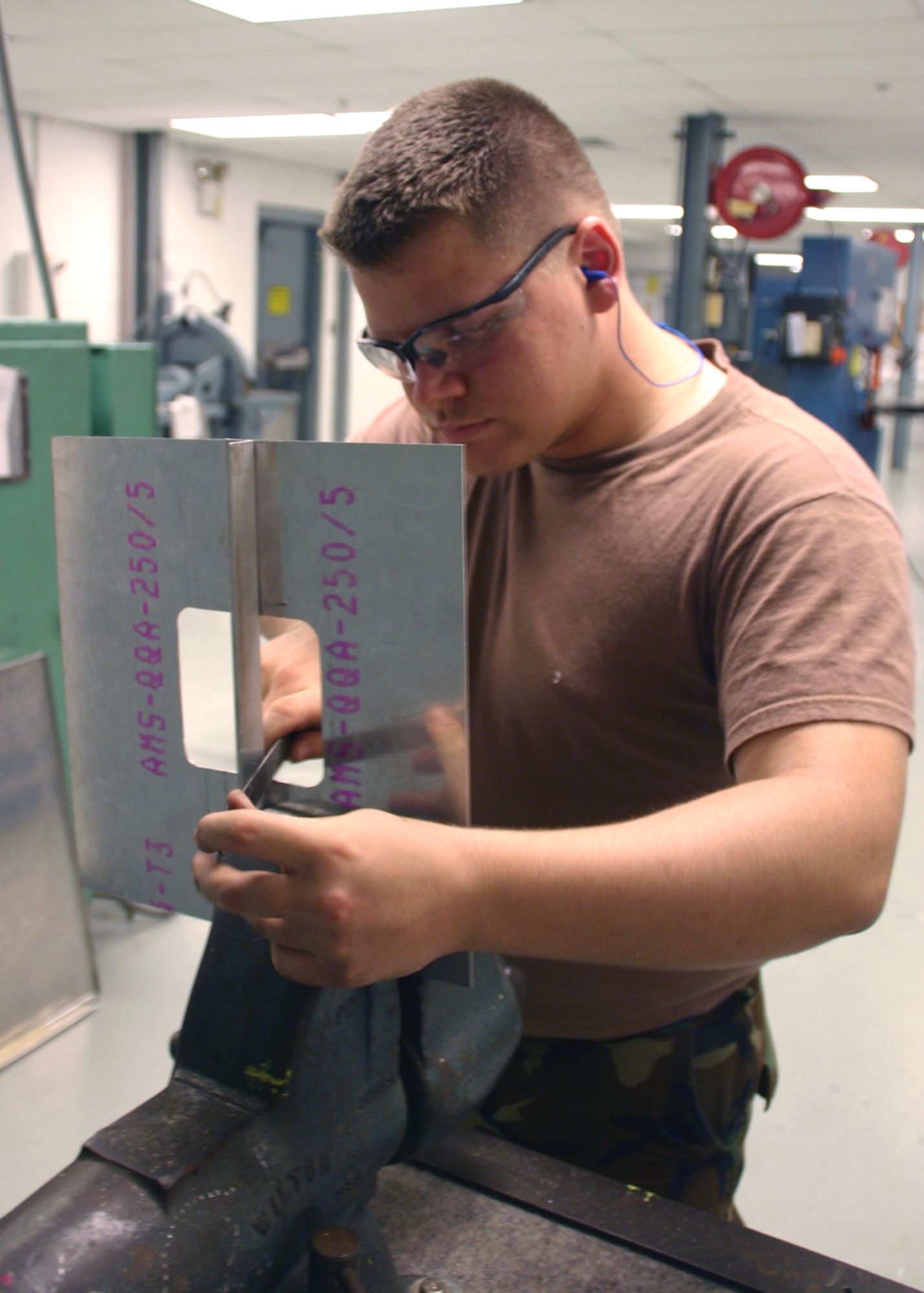 Airman 1st Class Aaron Gilks, 552nd Maintenance Squadron Fabrication Flight, completes a training project for his upgrade training.  Members of the Fabrication Flight are known by many in the 552nd Maintenance Group for their ability to create numerous items out of sheet metal.  (Photo by Staff Sgt. Stacy Fowler)