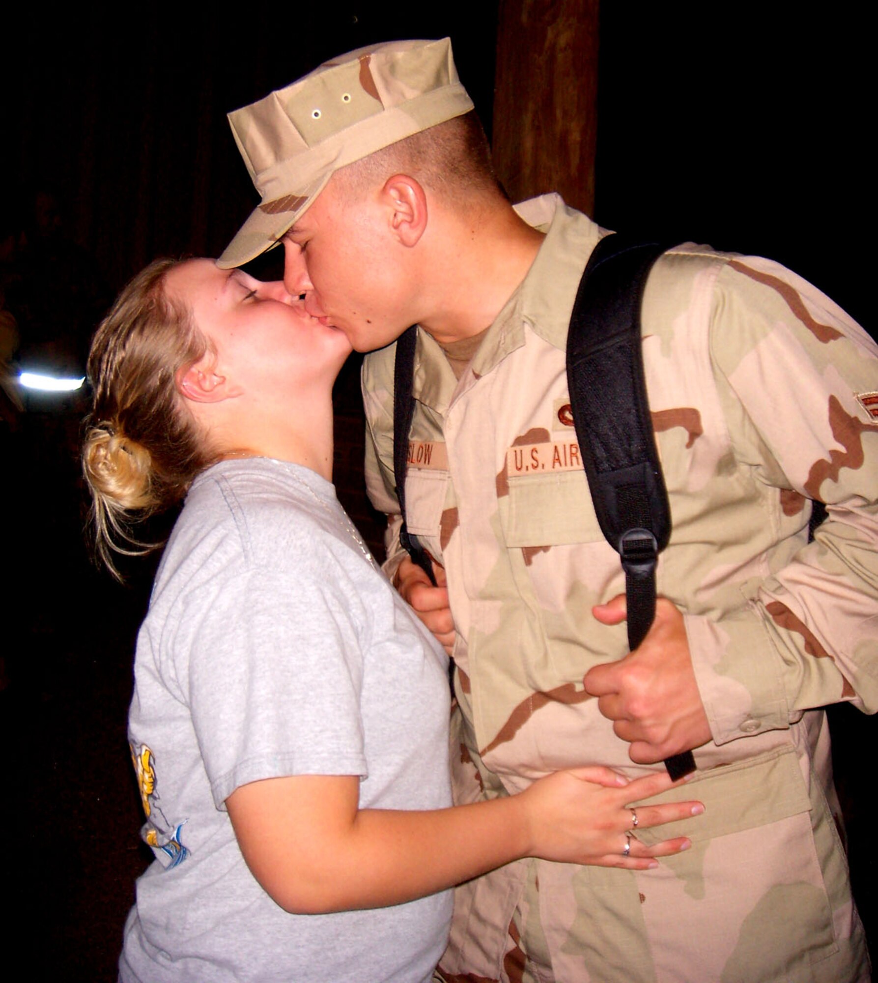 Airman 1st Class Jake Kinslow, 49th Civil Engineer Squadron, kisses his girlfriend goodbye before hopping on an airplane to Southwest Asia. More than 35 Holloman Airmen leave early Sept. 6 for a deployment in support of the War on Terror. These Airmen are a part of approximately 700 Airmen deploying in the upcoming Air and Space Expeditionary cycle. (U.S. Air Force photo/Airman 1st Class Heather Stanton)