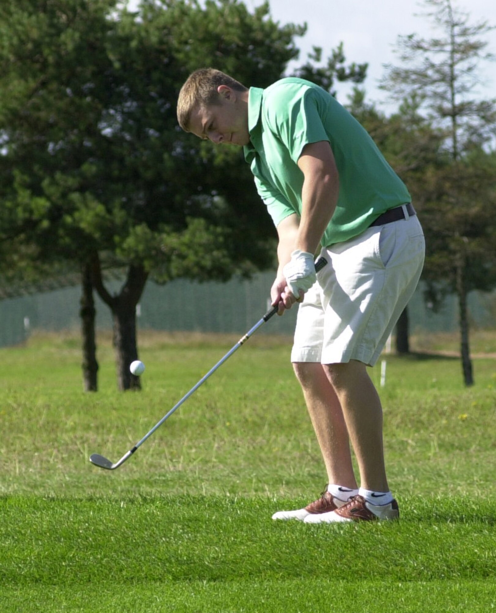 Andy Hunn, who plays off a handicap of six, goes close with a delicate chip onto the 13th green, thus keeping the 100th Logistics Readiness Squadron ahead in their match against the 352nd Maintenance Squadron during the intramural golf championship at Breckland Pines Golf Club, Sept. 4. His team went on to win the golf championship defeating 352nd Maintenance Squadron 12-0. (U.S. Air Force photo by Gary Rogers)
