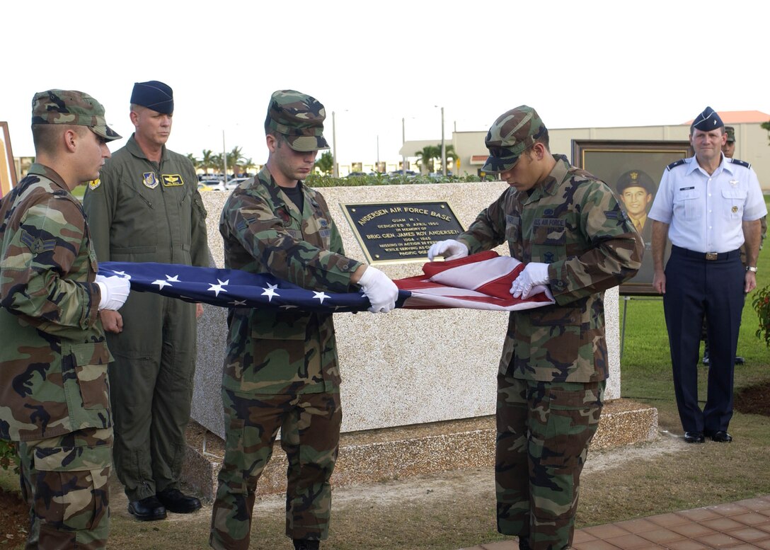 ANDERSEN AIR FORCE BASE, Guam - Brig. Gen. Doug Owens, 36th Wing
commander, and Col. Joel Westa, 36th WG vice commander, stand at
attention as Airmen from Andersen's Honor Guard perform the flag folding
ceremony during the plaque rededication ceremony held at 4:45 p.m. today
at the 36th WG Headquarters Building.  The base held the rededication
ceremony to unveil the original plaque that named Andersen after its
namesake Brig. Gen. Roy Andersen.  General Andersen was a former chief
of staff of the Army Air Forces in the Pacific who died in an aircraft
accident over the Pacific Ocean in 1945.  The plaque was originally
dedicated in 1949 when North Field was renamed Andersen Air Force Base.
The event was one of many held during Guam's Air Force Week to honor the
Air Force's 60th Anniversary. (Photo by Senior Airman Sonya Padilla/
36th Wing Public Affairs)
