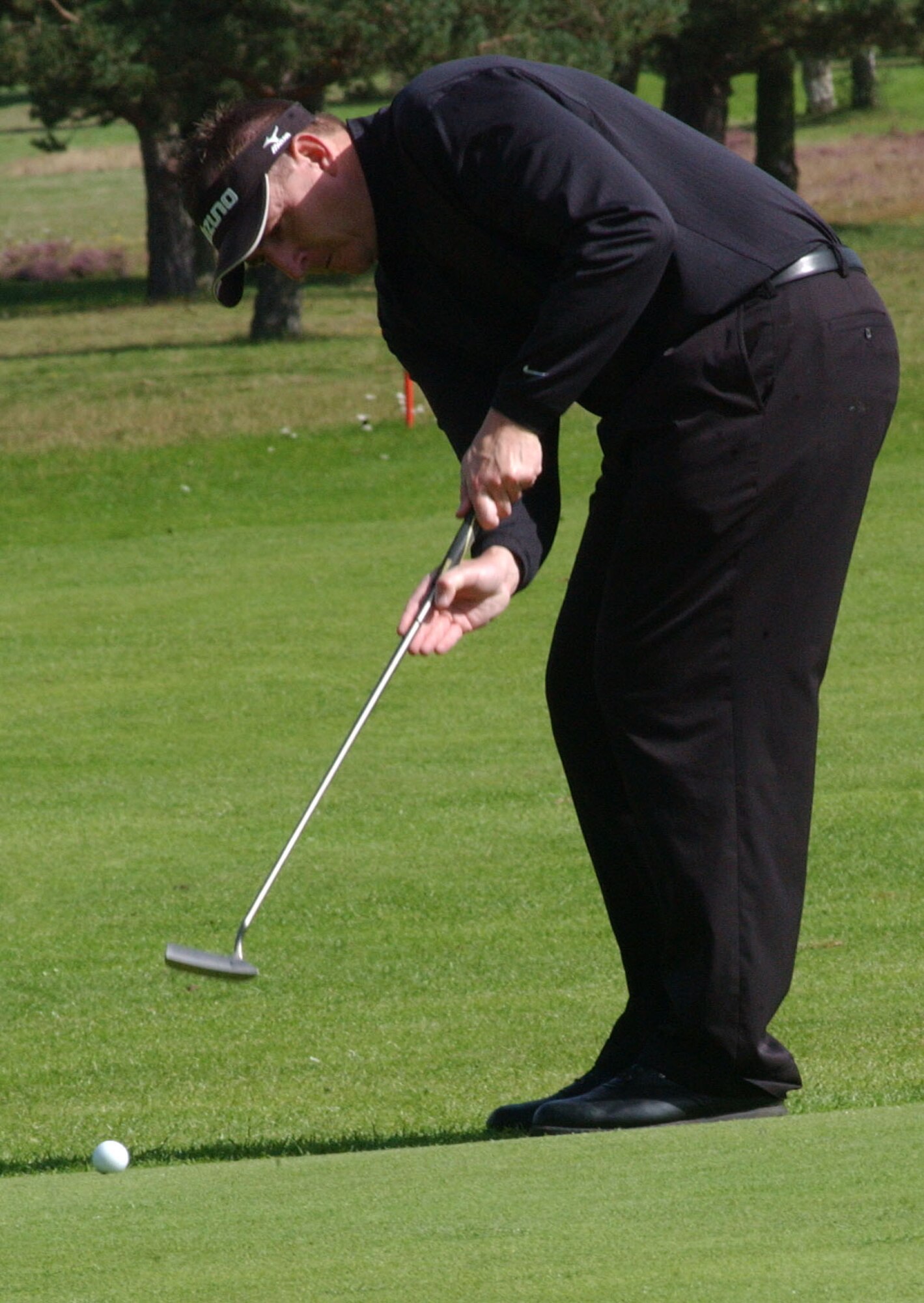 Paul Lyons, playing for the 100th Logistics Readiness Squadron, attempts a long-range birdie putt on the 16th green during the intramural golf championship at Breckland Pines Golf Club, Sept. 4. His team went on to win the golf championship defeating 352nd Maintenance Squadron 12-0. (U.S. Air Force photo by Airman Brad Smith)