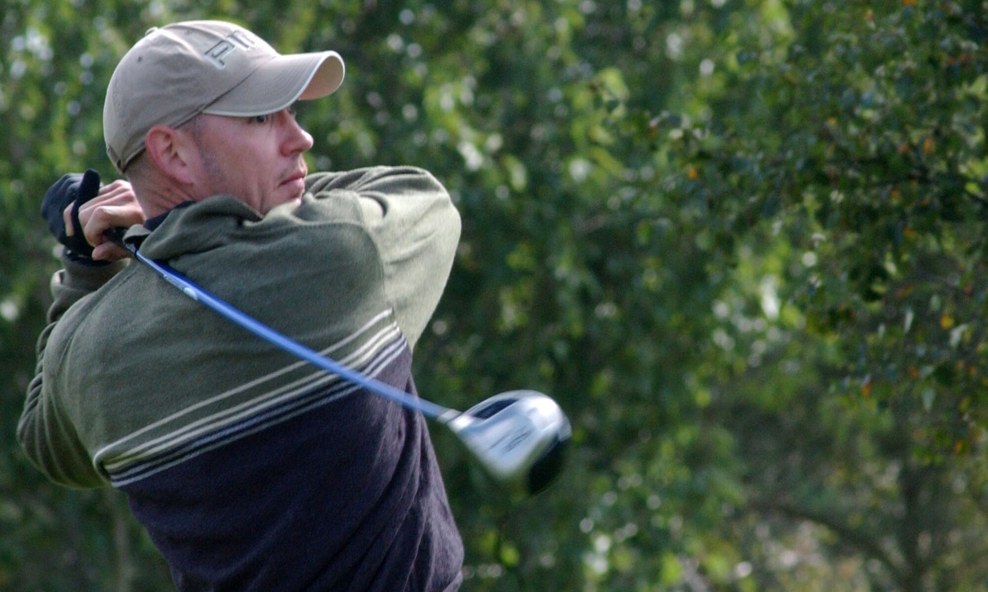 Stephan Boczar hits a good drive down the 16th fairway for the 352nd Maintenance Squadron during the RAF Mildenhall intramural golf championship at Breckland Pines Golf Club, Sept. 4. (U.S. Air Force photo by Airman Brad Smith)