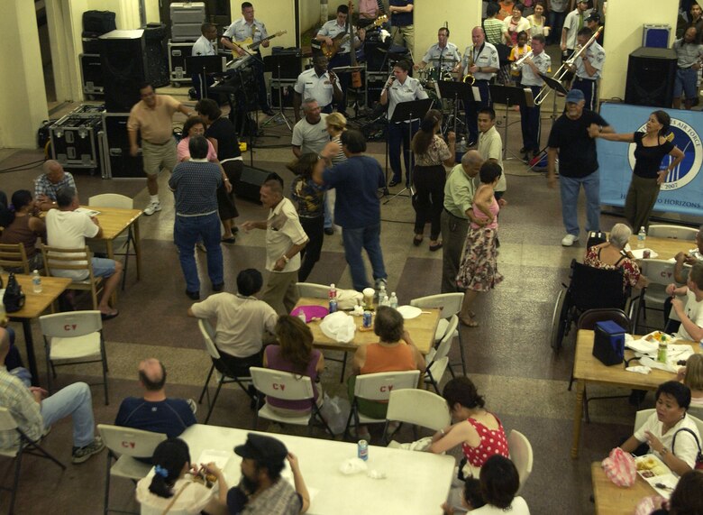 HAGATNA, Guam - Dancers take center stage as the U.S. Air Force Band of the Pacific's Alaskan Express performs at Chamorro Village in Hagatna, Guam.  The band visited the island in conjunction with Guam's Air Force Week.  Chamorro Village was one of many locations the band performed at from Sept. 4 to 8.  (Photo by Tech. Sgt. Brian Bahret/ 36th Wing Public Affairs)