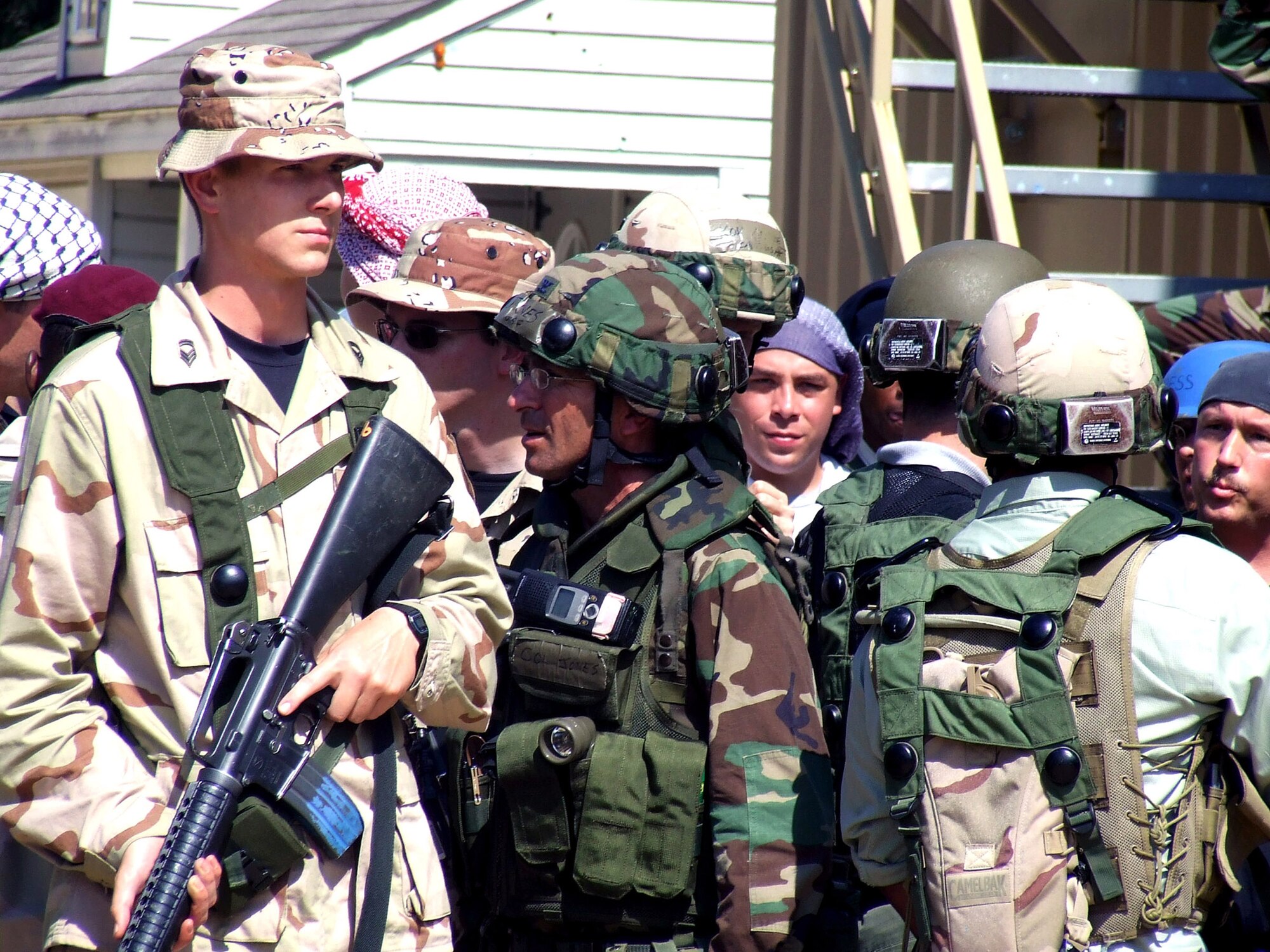 Students and role players hold a scenario in the fictional village of Citheron for Air Force Exercise Eagle Flag 07-6 Aug. 27 at Naval Air Engineering Station Lakehurst, N.J. The exercise is operated by the Air Force Expeditionary Center's 421st Combat Training Squadron from Fort Dix, N.J. (U.S. Air Force photo/Tech. Sgt. Scott T. Sturkol)
