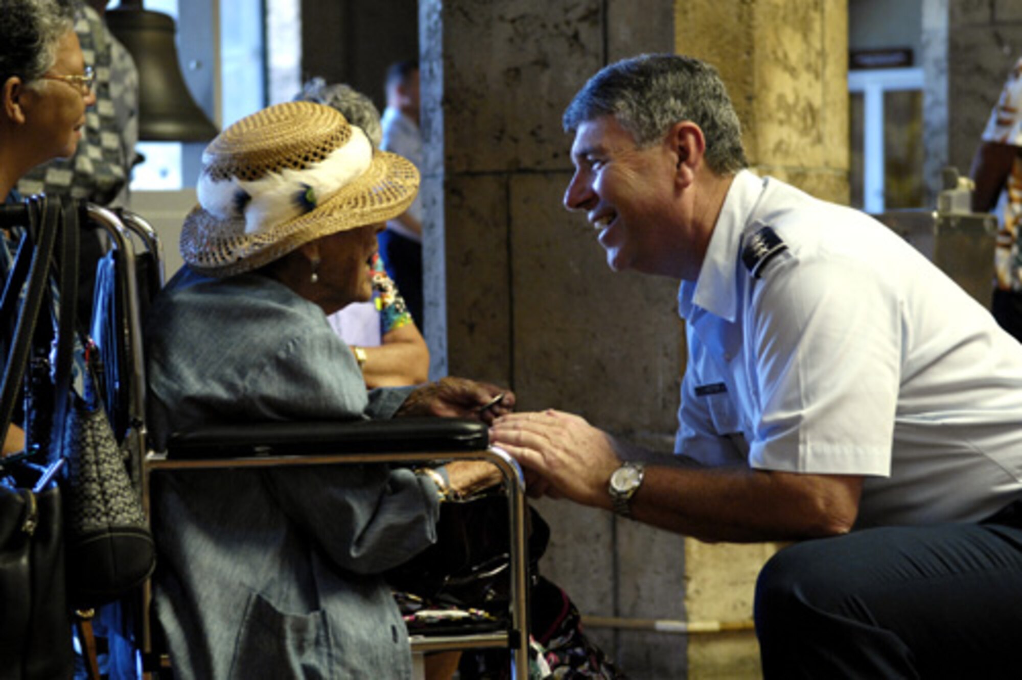 HONOLULU, Hawaii -- Gen. Paul V. Hester, commander of Pacific Air Forces, talks with local resident Mary Mbotelho, a former Army Air Corps member, at Honolulu Hale during an Air Force Week Honolulu proclamation ceremony. (U.S. Air Force photo/Tech. Sgt. Shane A. Cuomo)