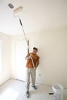 Spending his Saturday to help others, Richard Cardenas paints the ceiling of a bedroom in a Habitat for Humanity of San Antonio house. Mr. Cardenas, who works for the 37th Civil Engineer Squadron at Lackland AFB, Texas, was one of 24 volunteers who worked on the Palo Alto build site. (USAF photo by Robbin Cresswell)