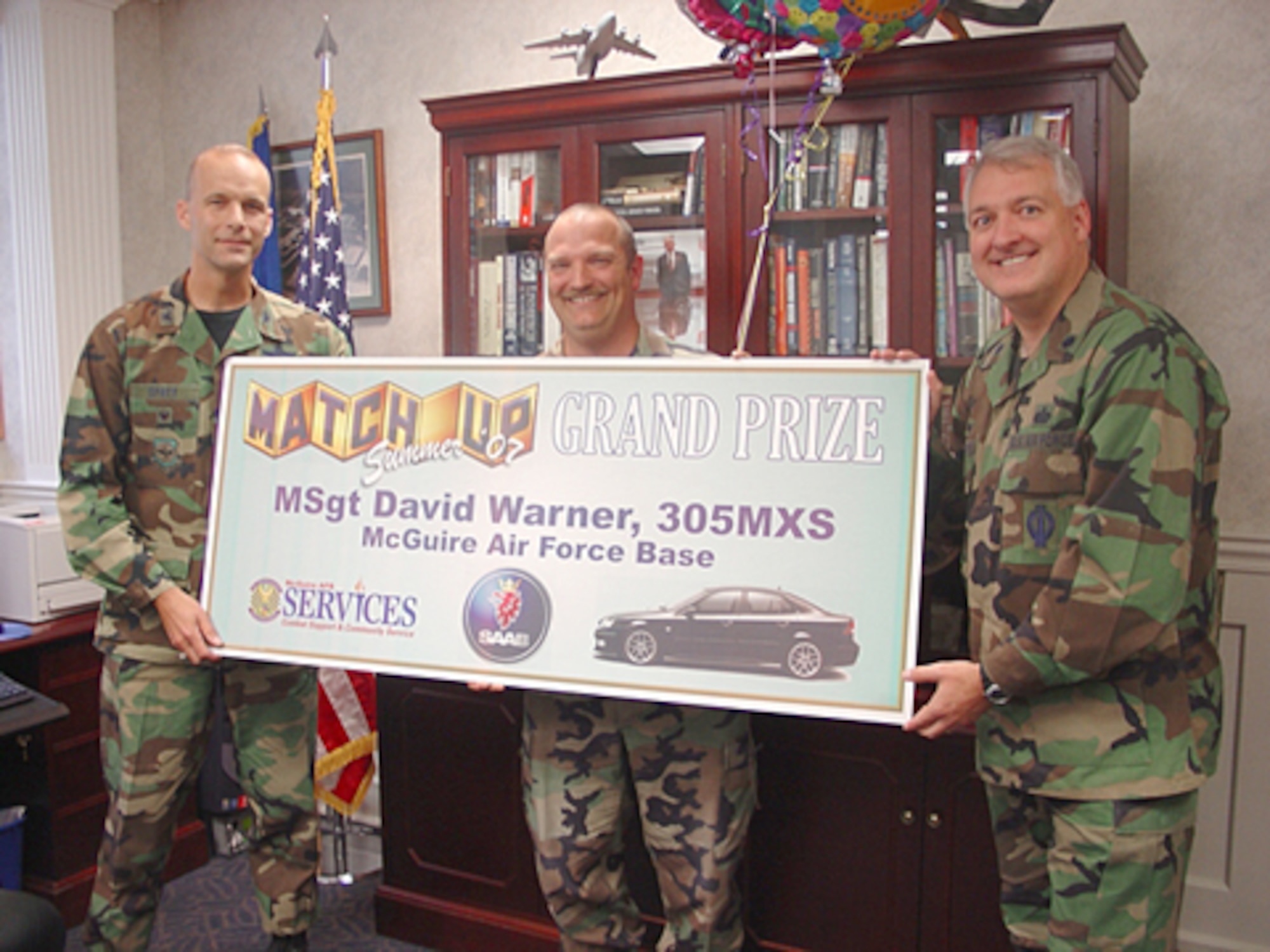 Master Sgt. David Warner, 305th Maintenance Squadron, won the Air Mobility Command MatchUp 2007 grand prize – a 2007 SAAB Aero 9-3. Col. Bill Spacy, 305th Air Mobility Wing vice commander, and Lt. Col. Roy Mathis, 305th Services Squadron commander, gave Sergeant Warner the prize check after he received the news from Lt. Gen. Christopher Kelly, Air Mobility Command vice commander, over the phone.