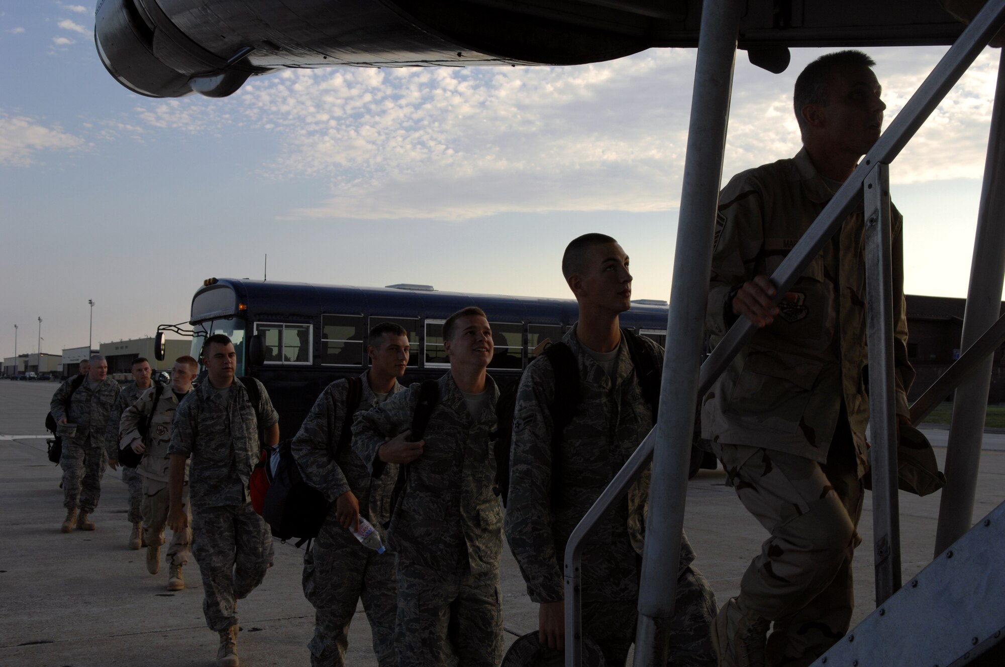 WHITEMAN AIR FORCE BASE, Mo. – Members of the 509th Bomb Wing board a commercial aircraft Sept. 6 on their way to support Operations Enduring Freedom and Iraqi Freedom. More than 600 members of Team Whiteman will be deployed around the world to support the war on terror as part of Air Expeditionary Forces 9 and 10. (U.S. Air Force photo/Airman 1st Class Stephen Linch)                   