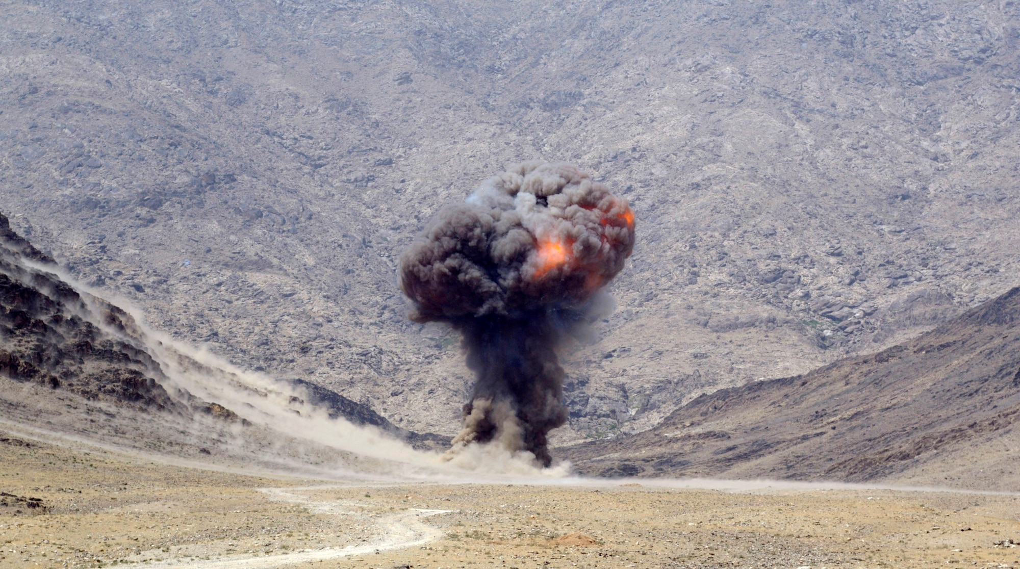 A controlled detonation is conducted Sept. 1 near Forward Operating Base Mehtar Lam, Afghanistan. Nearly 900 pounds of small arms ammunition, rocket-propelled grenades and mortars were turned in by provincial citizens under the small arms for rewards program. (U.S. Air Force photo/Master Sgt. Jim Varhegyi)

