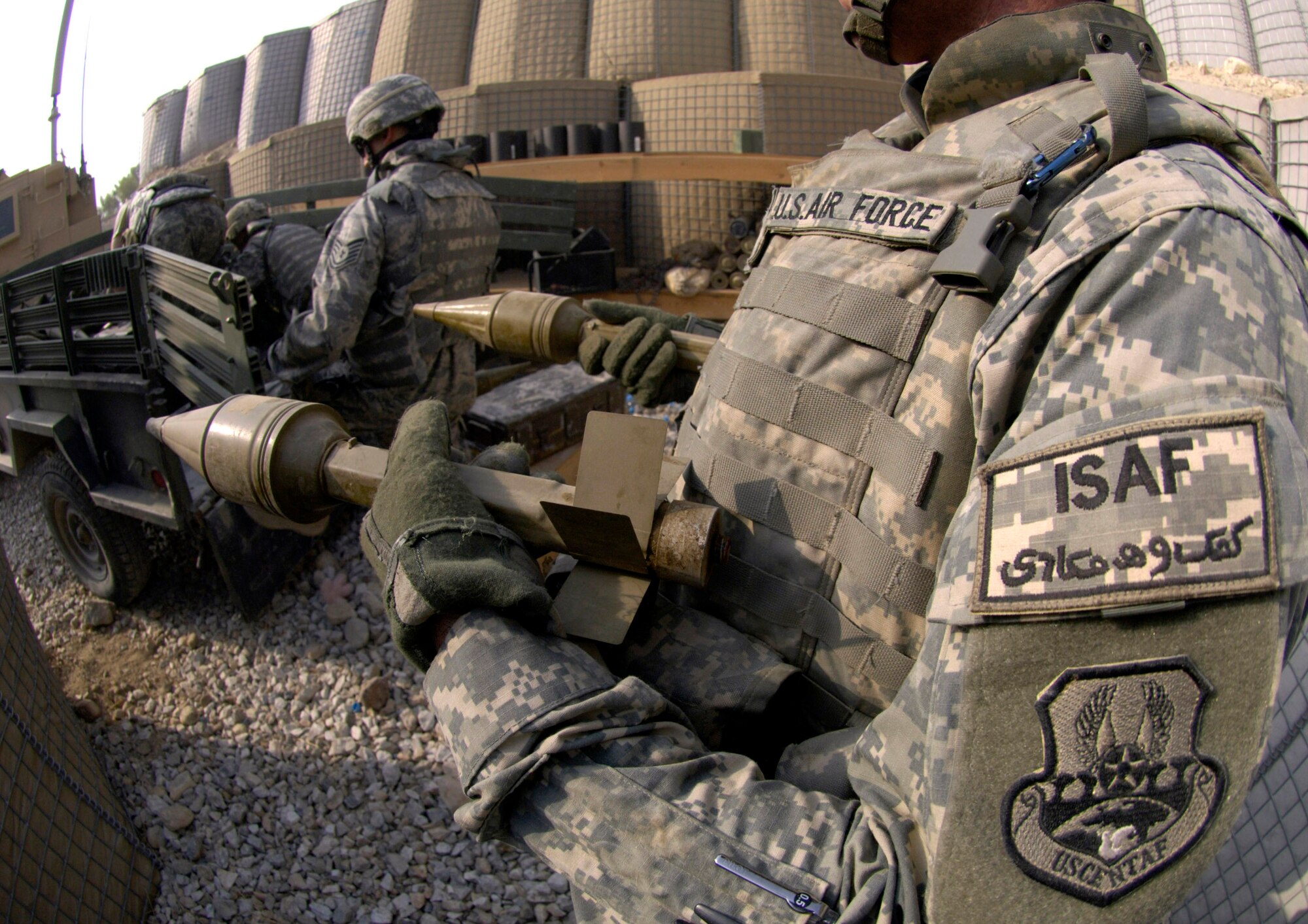 Air Force explosive ordnance disposal specialists ready ammunition for a controlled detonation Sept. 1 at Forward Operating Base Mehtar Lam, Afghanistan. Nearly 900 pounds of small arms ammunition, rocket-propelled grenades and mortars were turned in by provincial citizens. (U.S. Air Force photo/Master Sgt. Jim Varhegyi)
