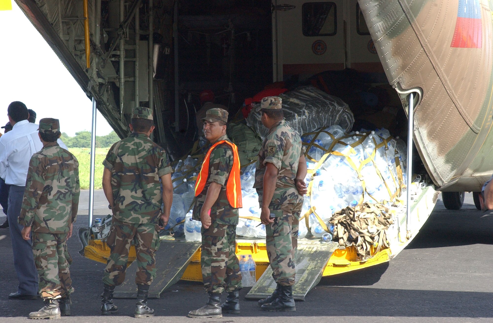 A Venezuelan Air Force C-130 sits on the tarmac in Managua, Nicaragua, waiting to be unloaded.  The C-130 is loaded with water and other relief supplies being donated by Venezuela.  The supplies are destined to be distributed at Puerto Cabezas and other locations throughout Nicaragua where they are needed in the wake of Hurricane Felix. U.S. Air Force photo by 1st Lt. Erika Yepsen.                               