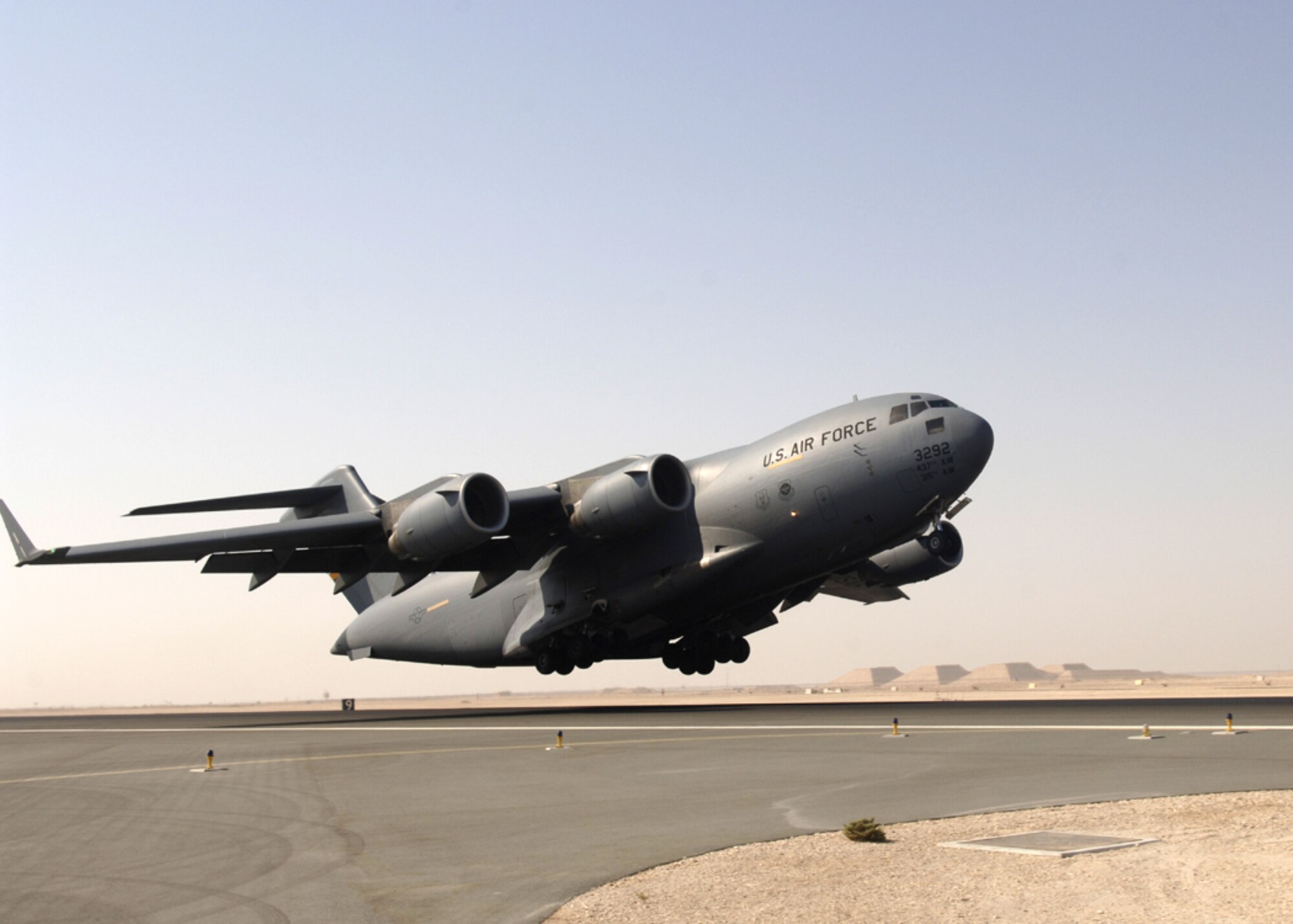 A C-17 Globemaster III takes off from a base in Southwest Asia. Coalition C-17s and C-130s flew 150 sorties and delivered 610 tons of cargo Sept. 6. The equivalent weight delivered is more than the weight of 32 F-16s. (U.S. Air Force photo)
