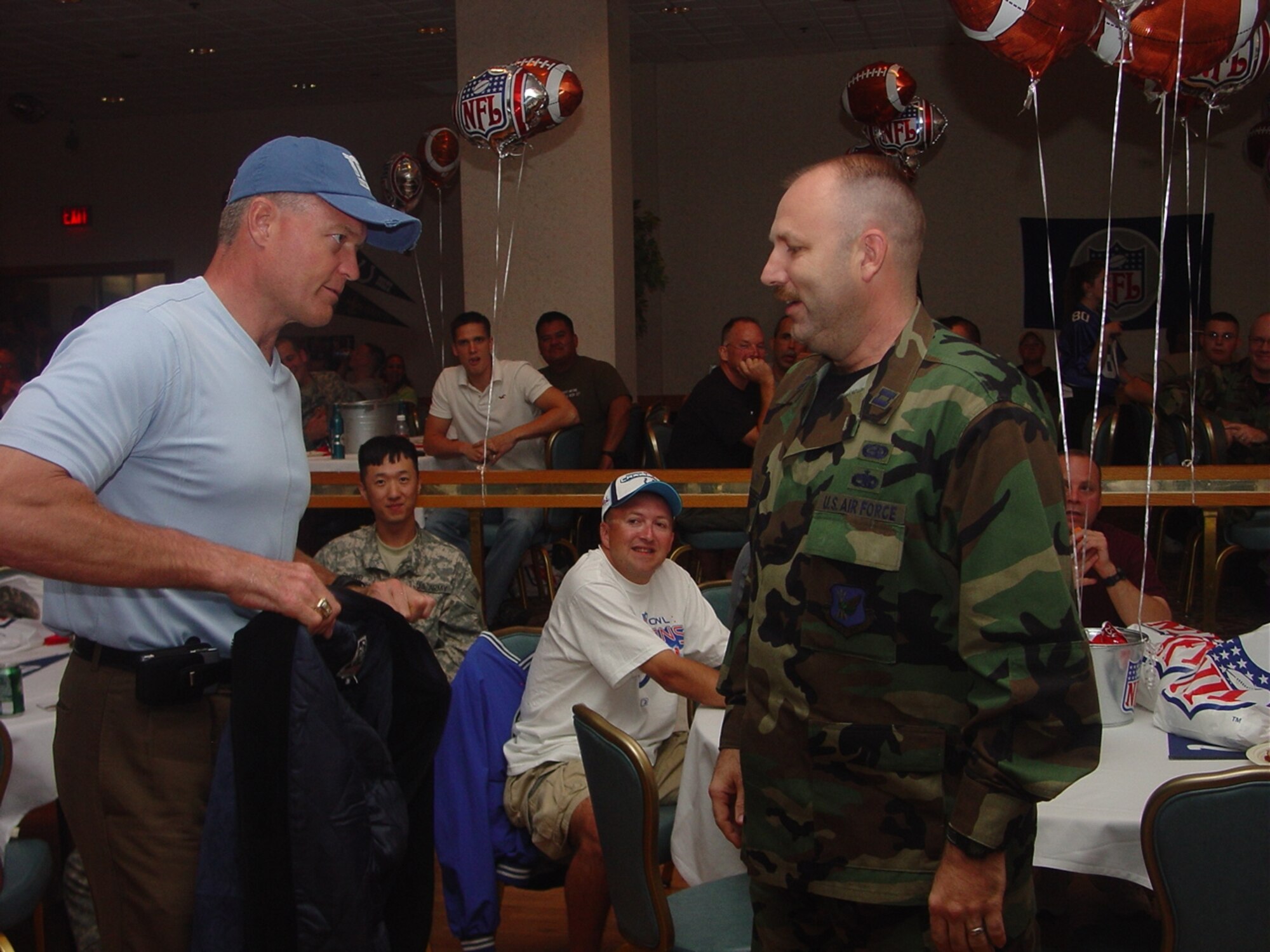 Hundreds of Team McGuire members participate in the kickoff of the NFL season at the McGuire Club. The USO and NFL provided food, football and prizes in appreciation for our military members.  